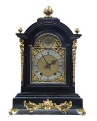 An English Ebonized and Gilt Metal Mounted Bracket Clock, Height of clock 21 inches.