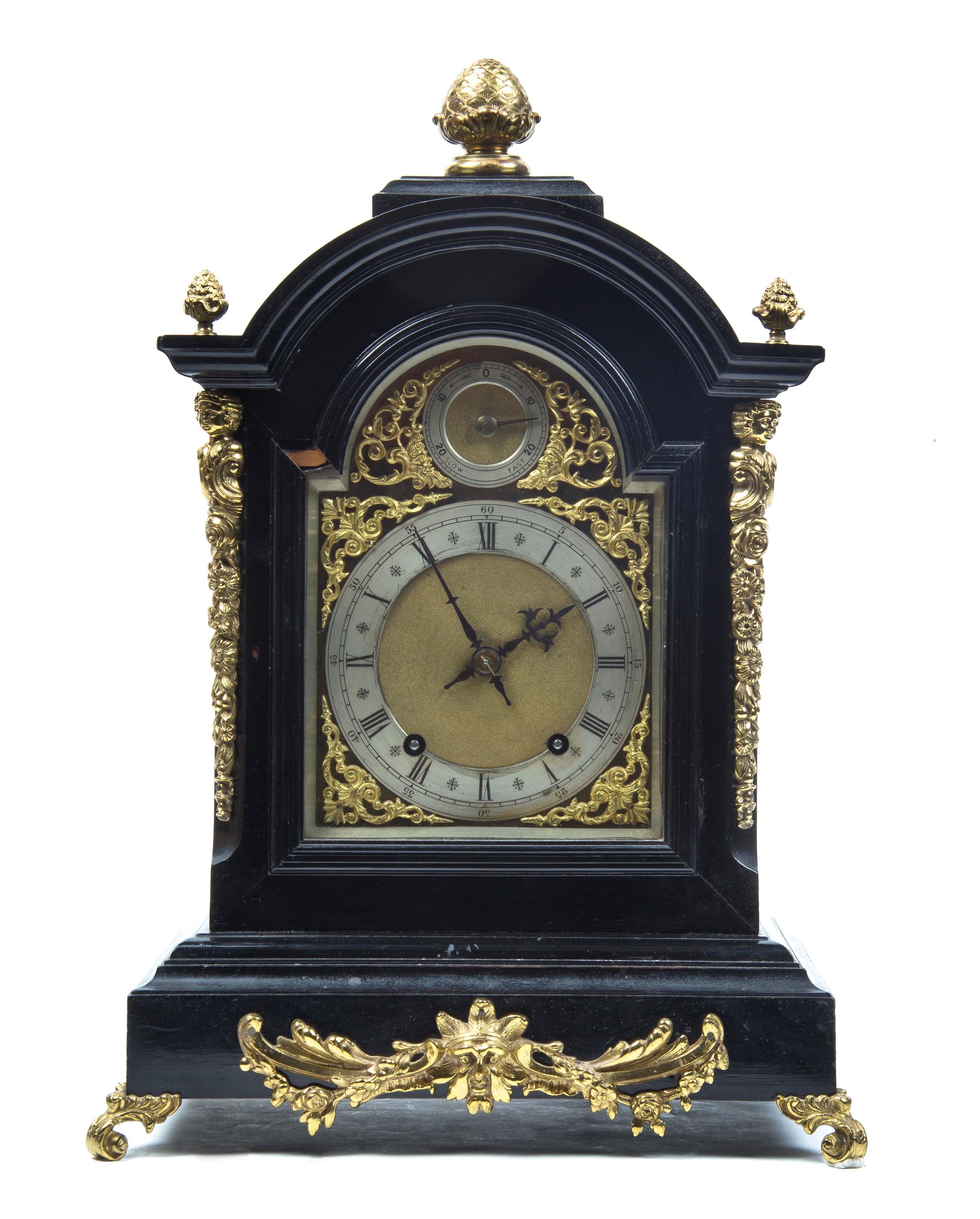 An English Ebonized and Gilt Metal Mounted Bracket Clock, Height of clock 21 inches.
