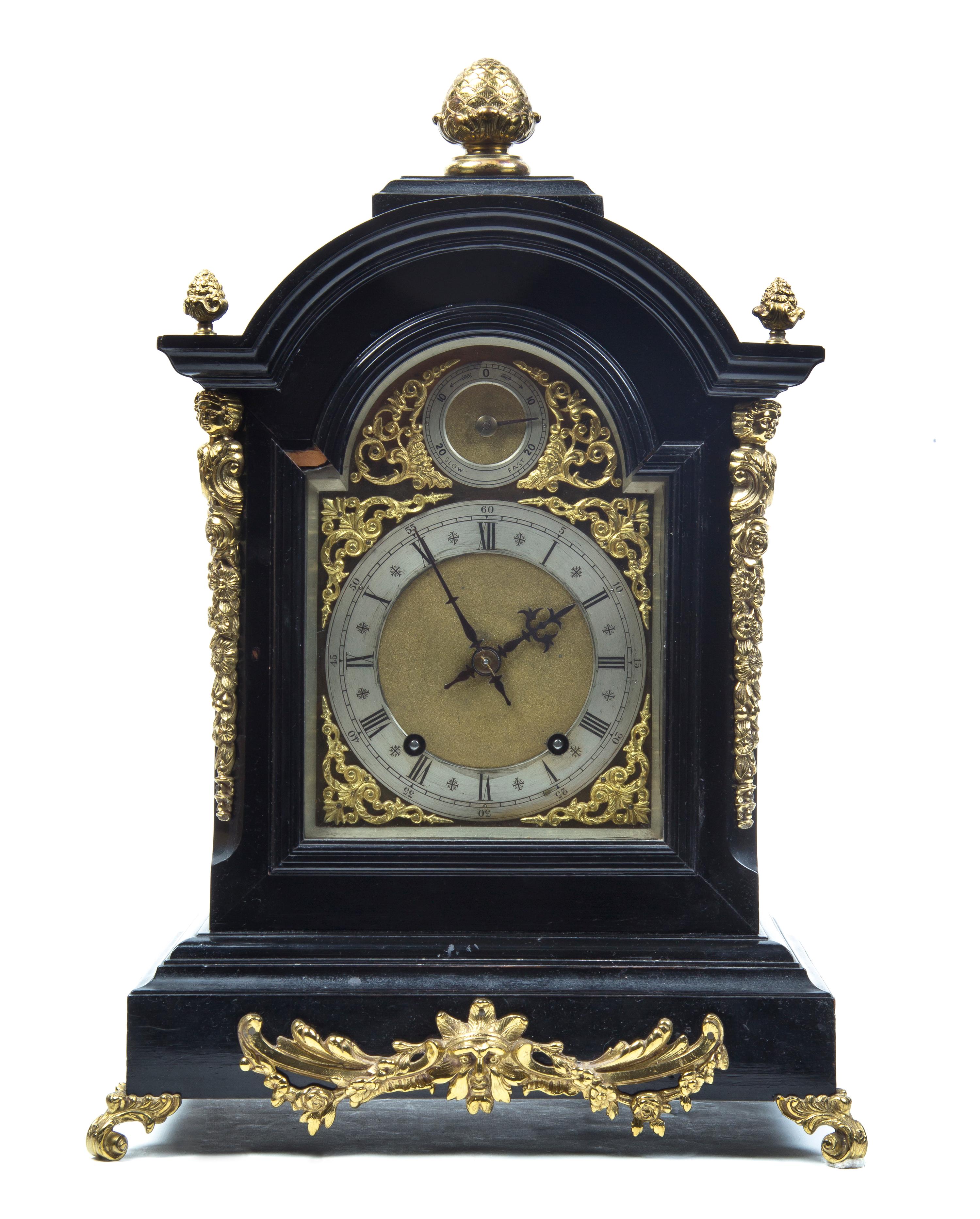 An English Ebonized and Gilt Metal Mounted Bracket Clock, Height of clock 21 inches.