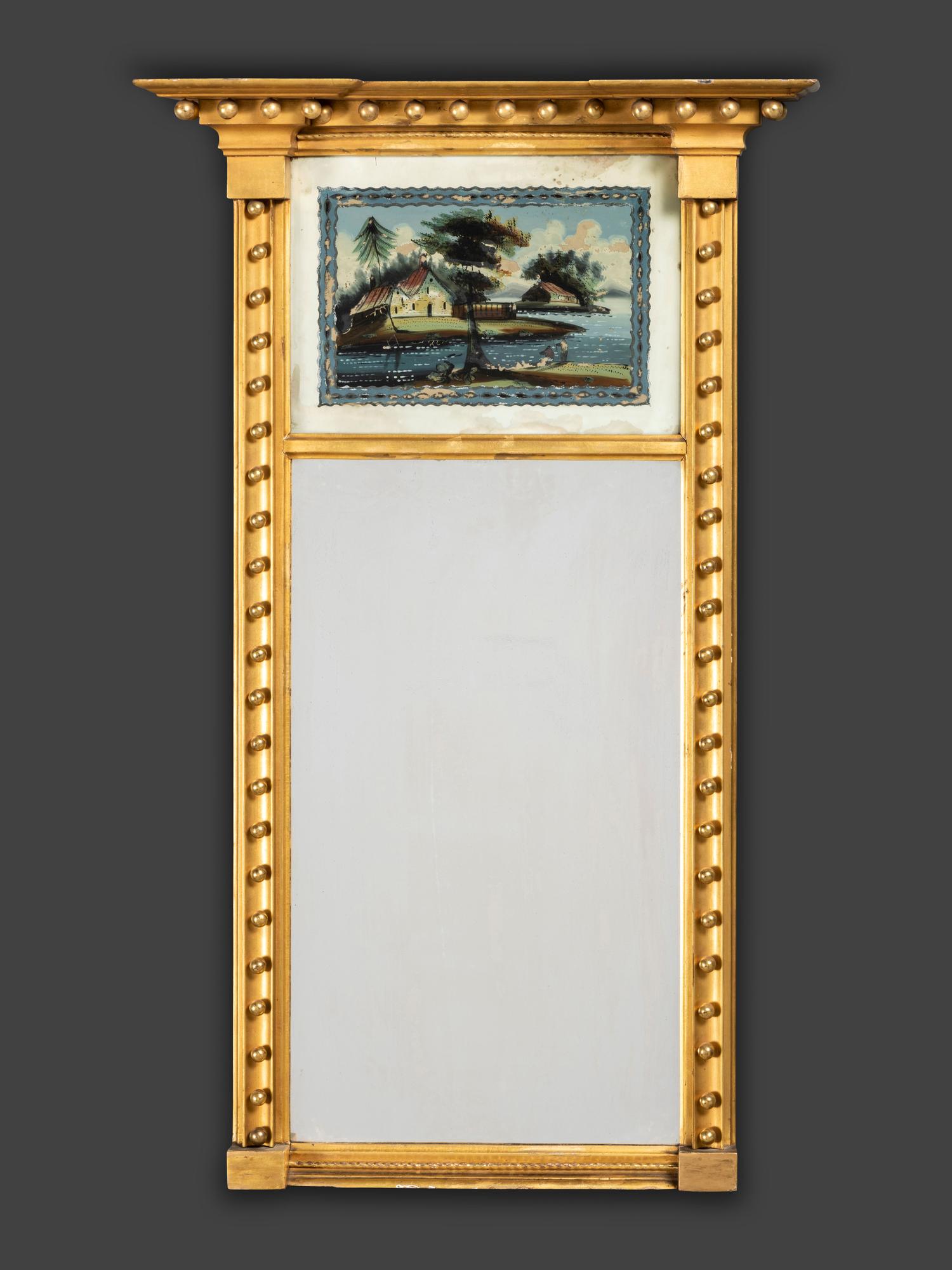 A Classical Giltwood and Reverse Painted Panel Inset Looking Glass