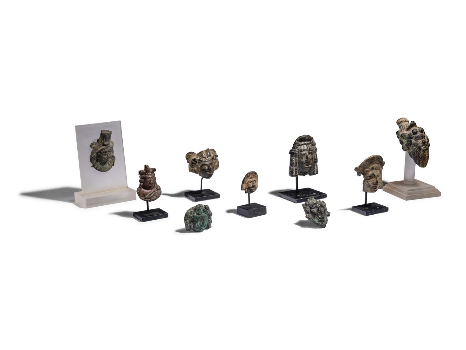 Nine Roman Bronze Masks