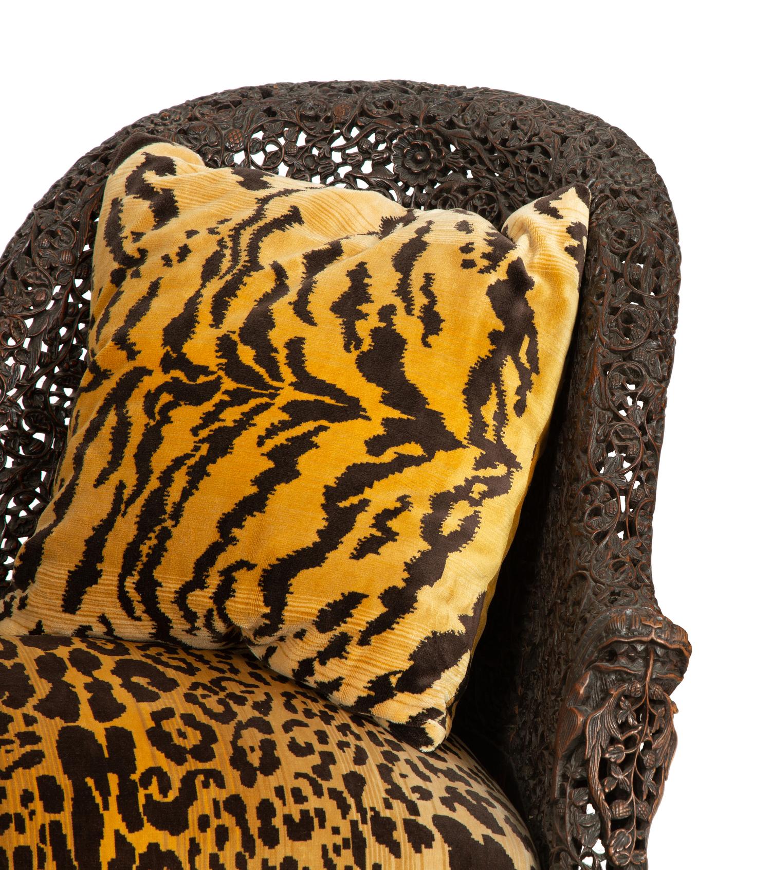Two Similar Anglo-Burmese Carved Teak Settees