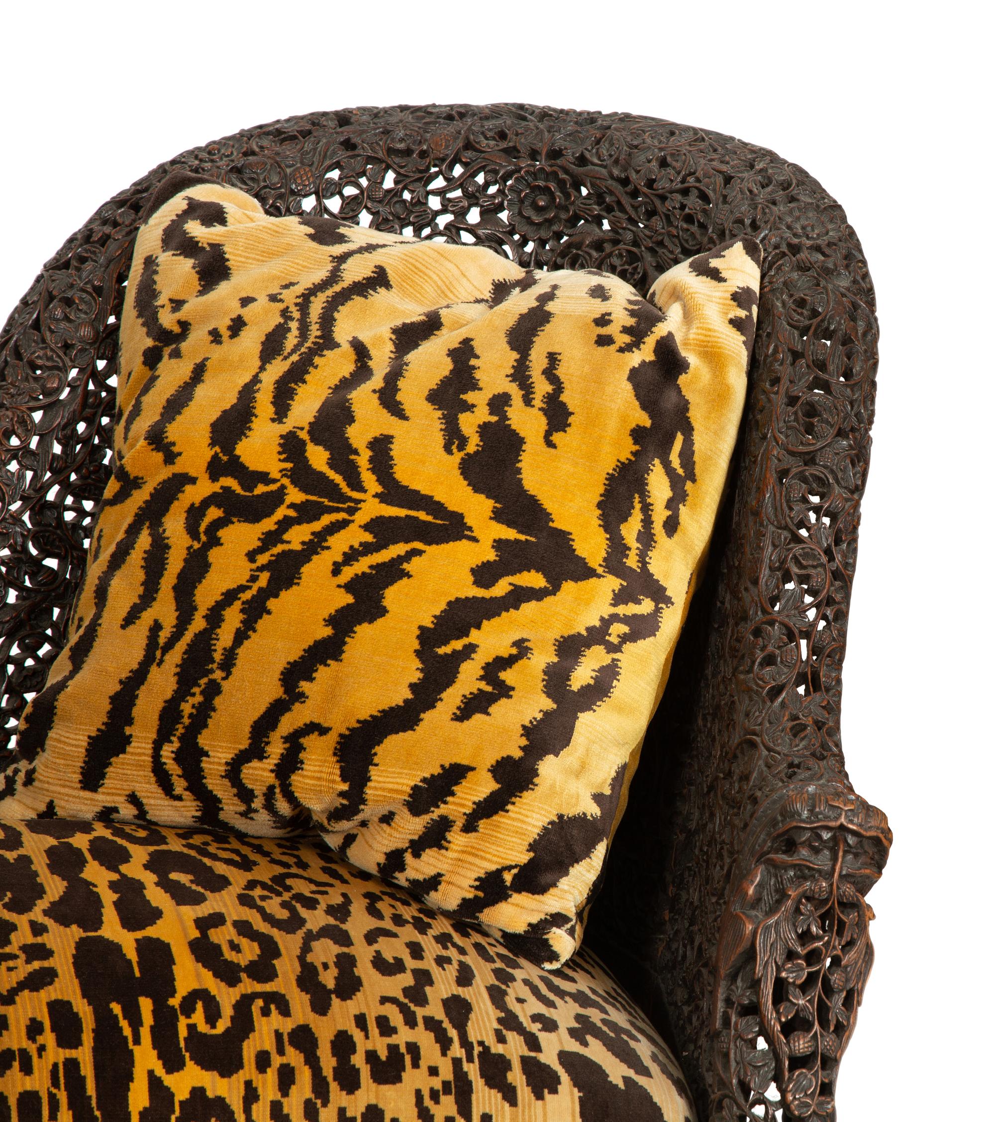 Two Similar Anglo-Burmese Carved Teak Settees