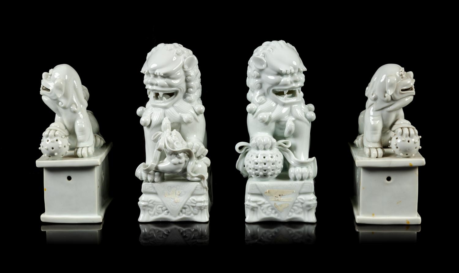 Two Pairs of Chinese Blanc-de-Chine Porcelain Figures of Fu Lions