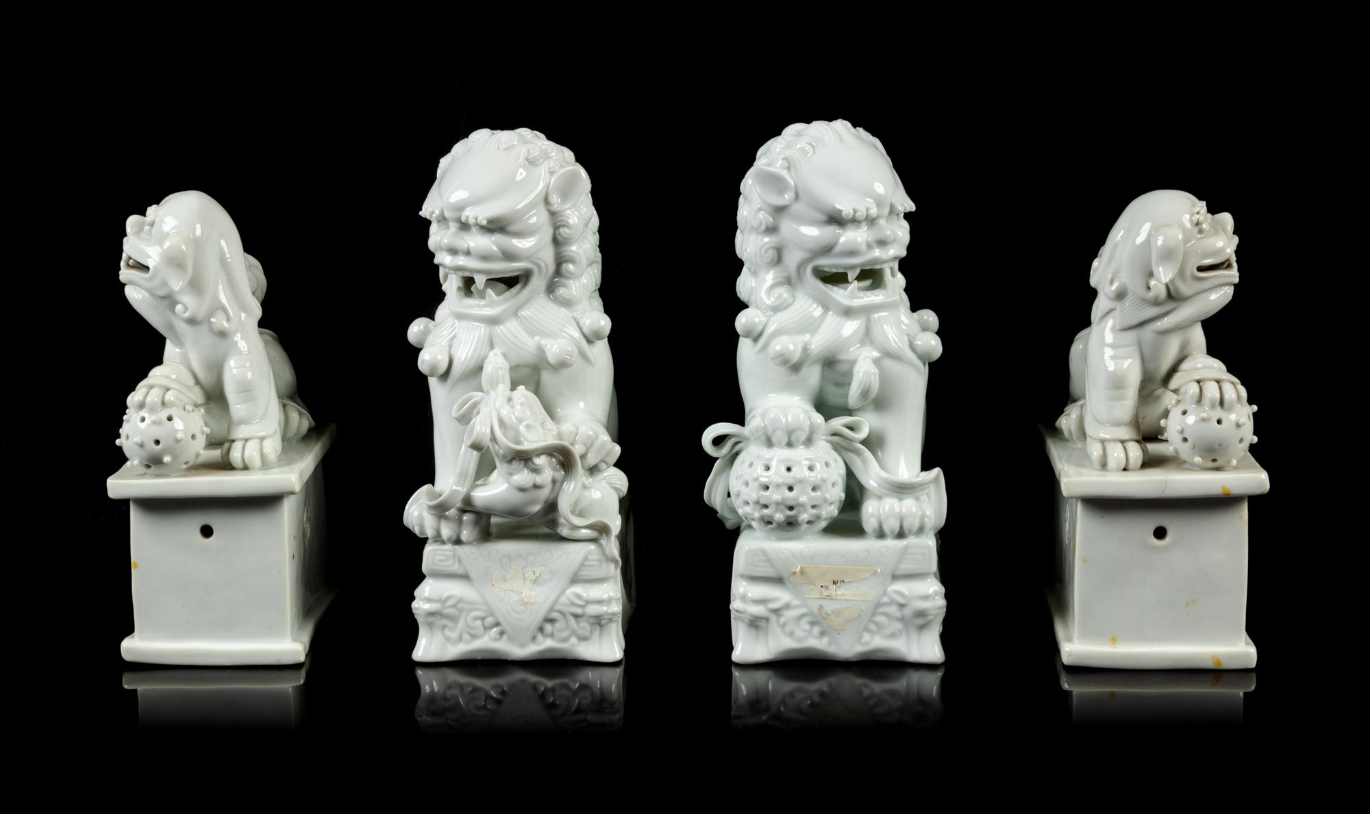 Two Pairs of Chinese Blanc-de-Chine Porcelain Figures of Fu Lions
