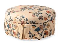 A Button-Tufted Circular Ottoman with Crewelwork Upholstery