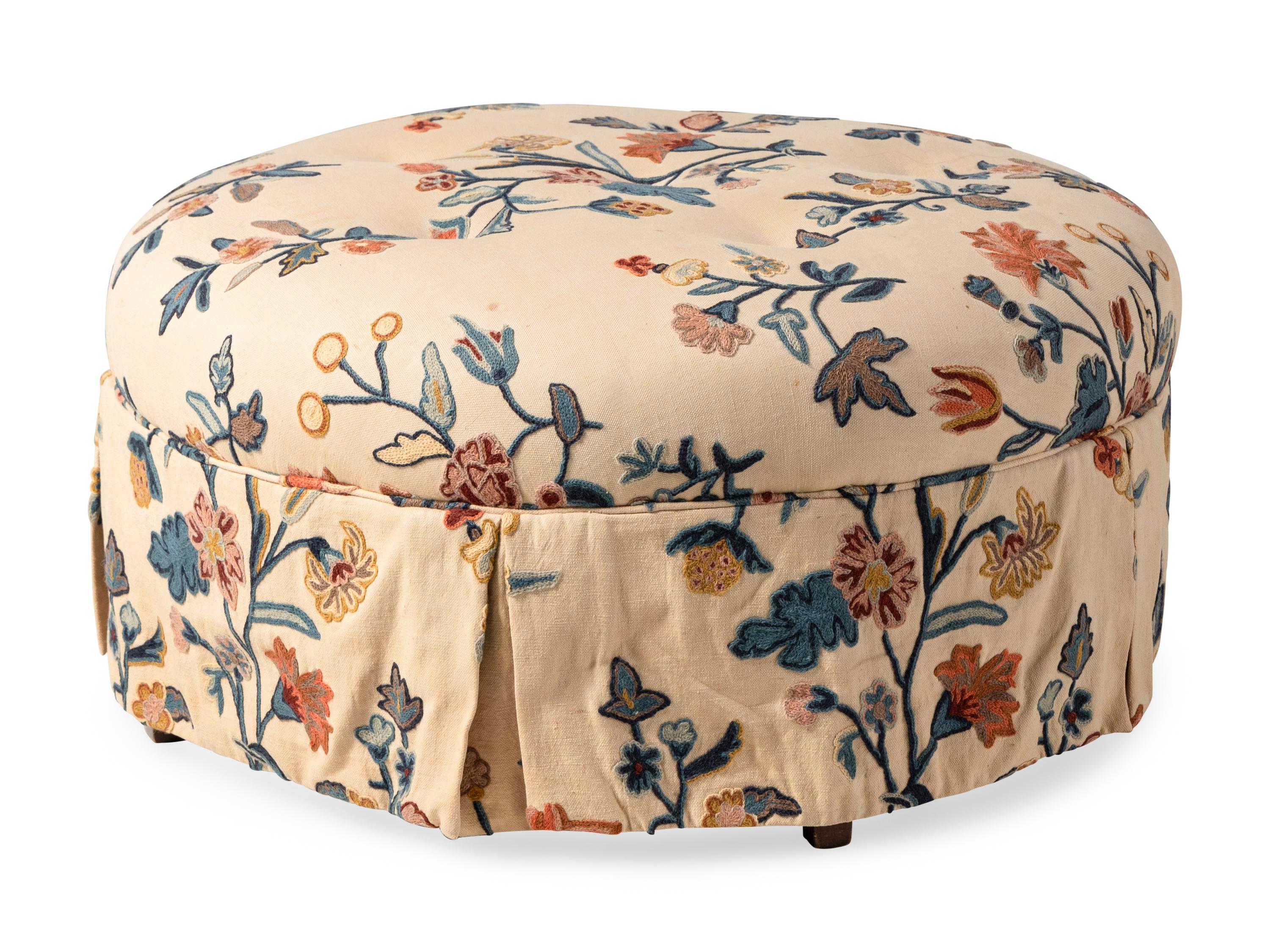 A Button-Tufted Circular Ottoman with Crewelwork Upholstery