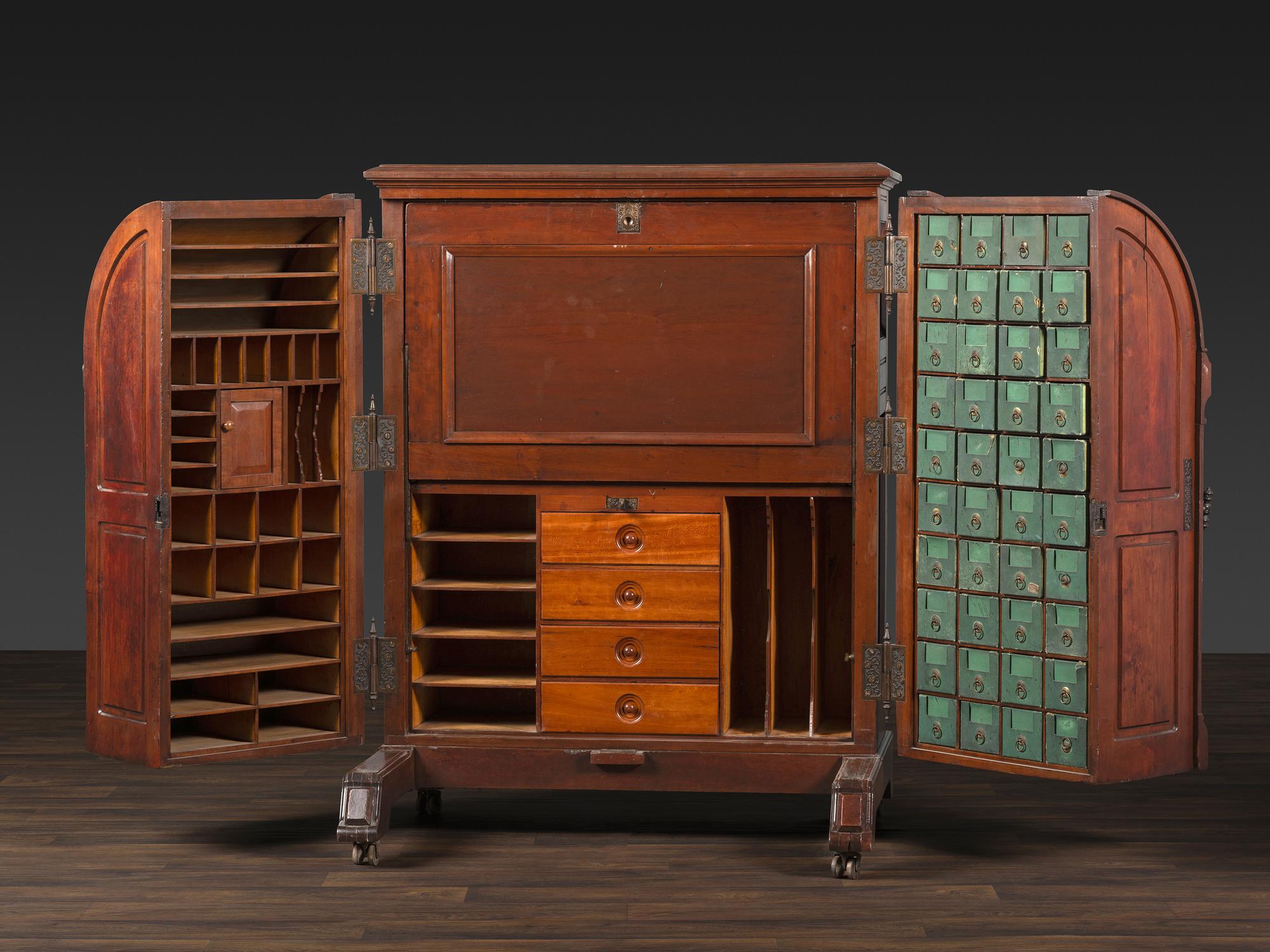 A Carved Walnut Wooton Secretary Desk