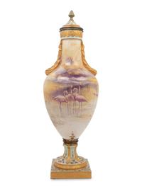 A French Painted and Parcel Gilt Porcelain Urn