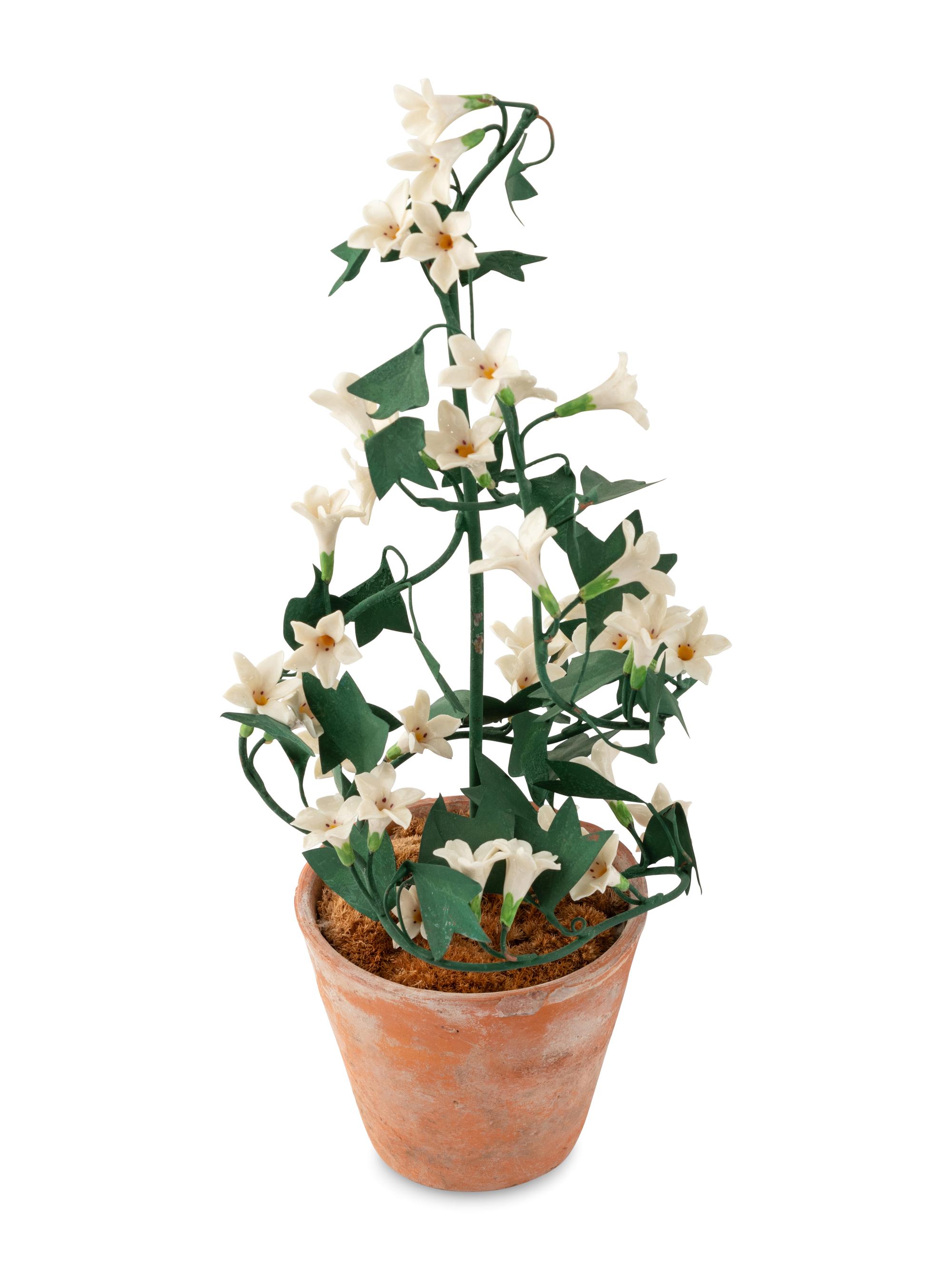 A Group of Tole and Porcelain Models of Flowers