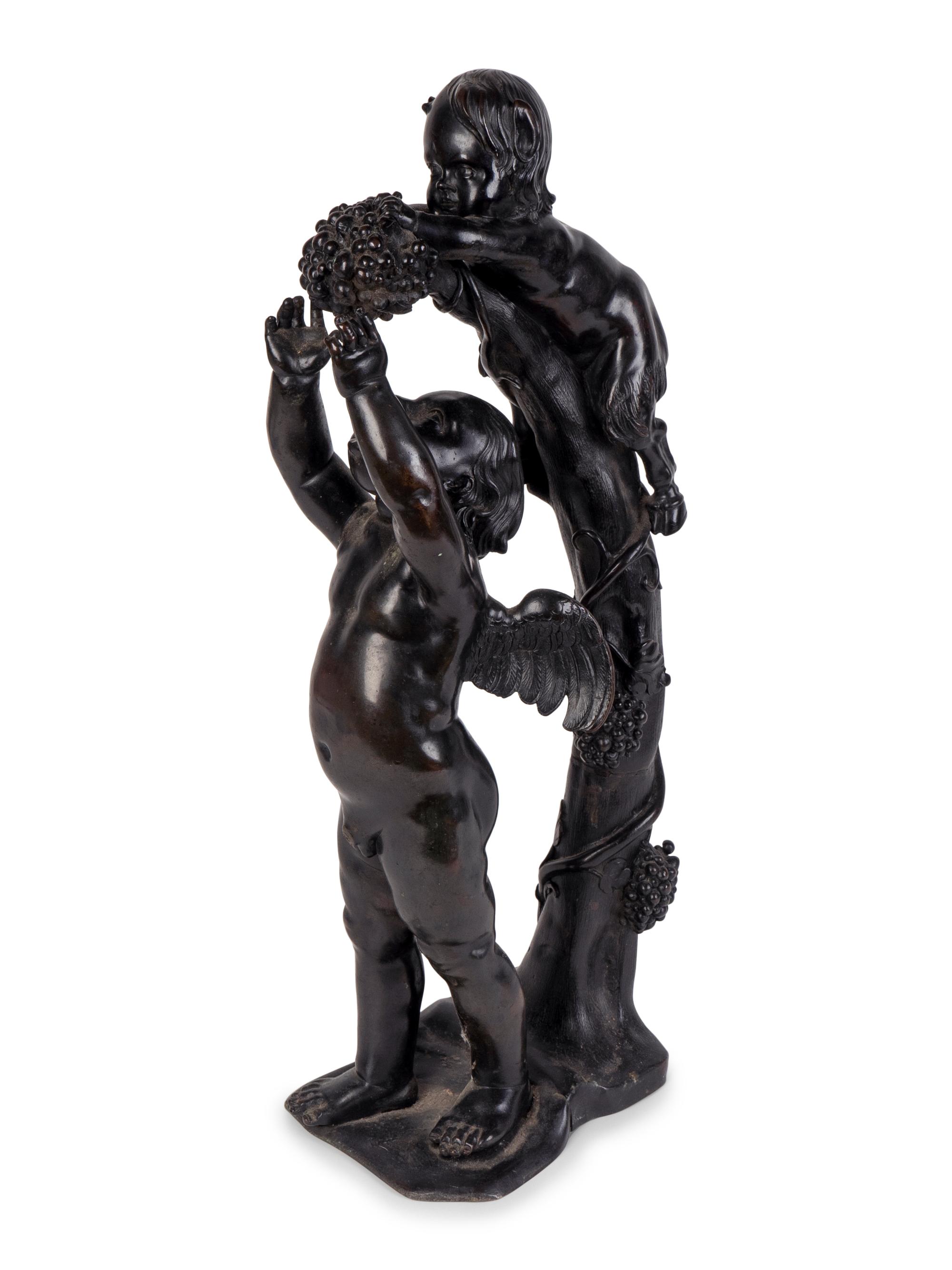 A Continental Patinated Bronze Group of Cupid and an Infant Satyr — CIRCA 1900