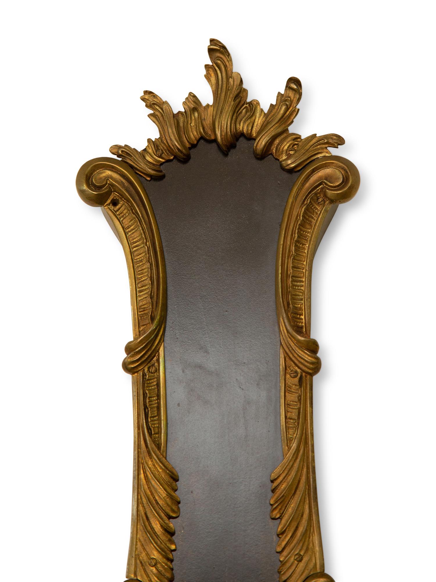A French Empire Style Ebonized and Parcel Gilt Banjo Clock