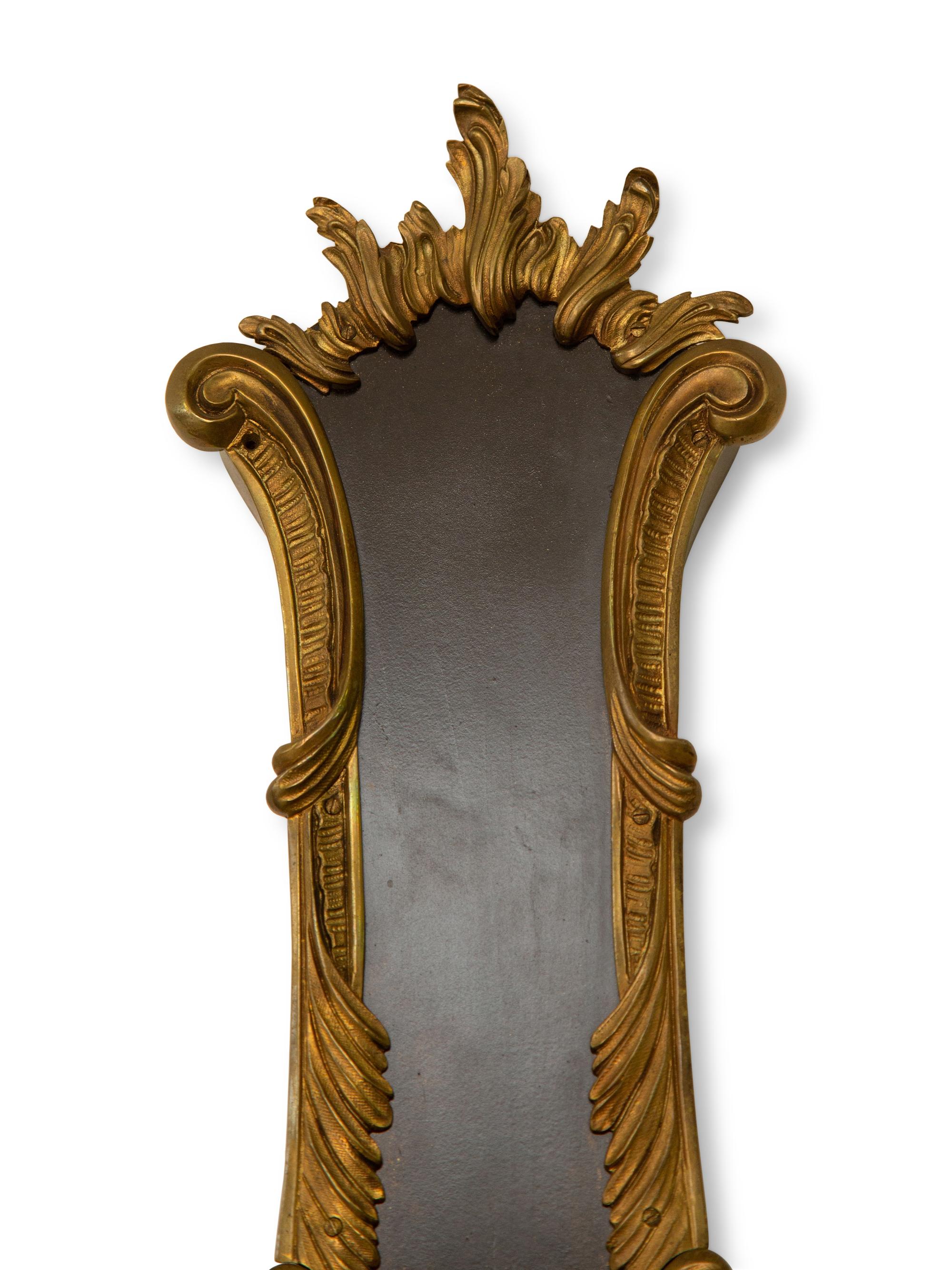 A French Empire Style Ebonized and Parcel Gilt Banjo Clock