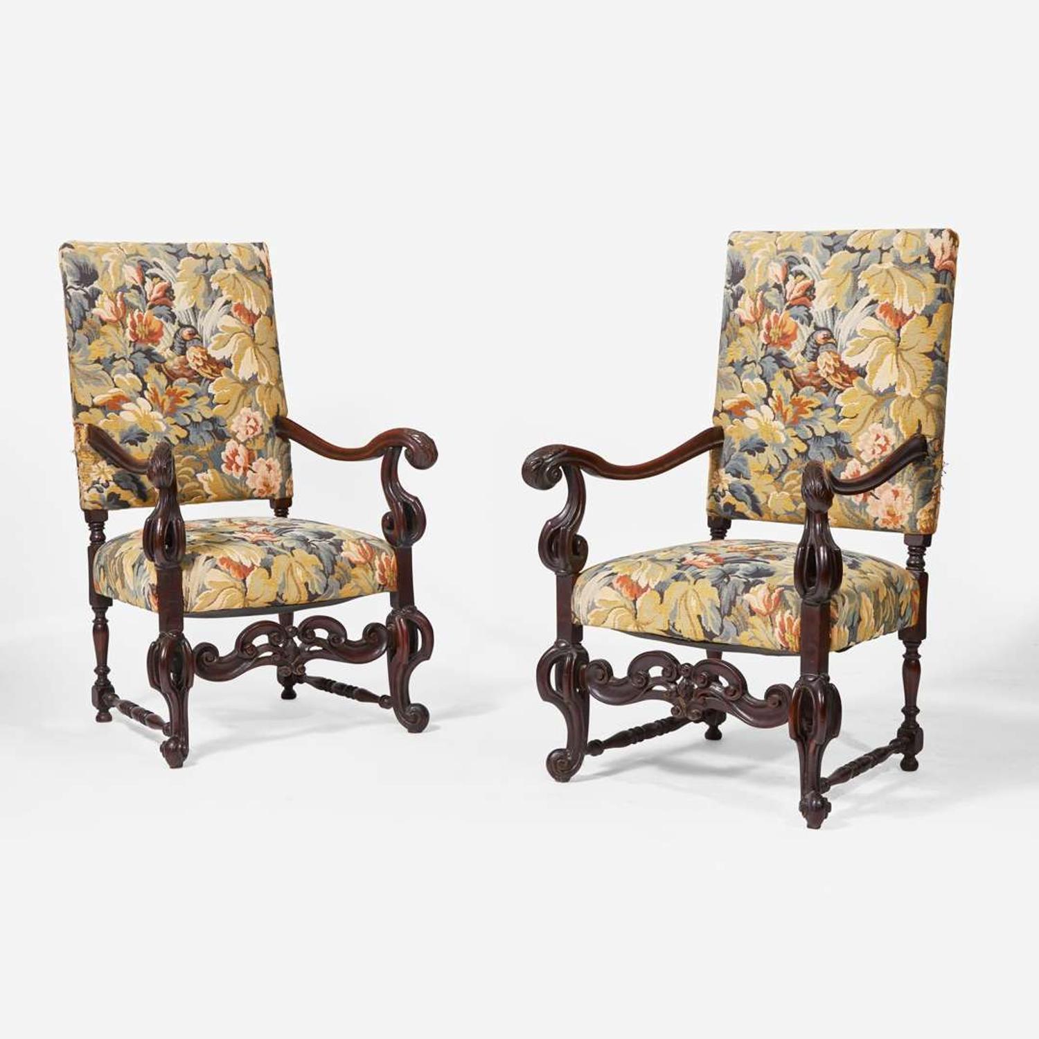 A pair of Baroque Revival carved walnut armchairs late 19th / 20th century