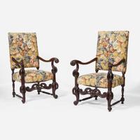 A pair of Baroque Revival carved walnut armchairs late 19th / 20th century