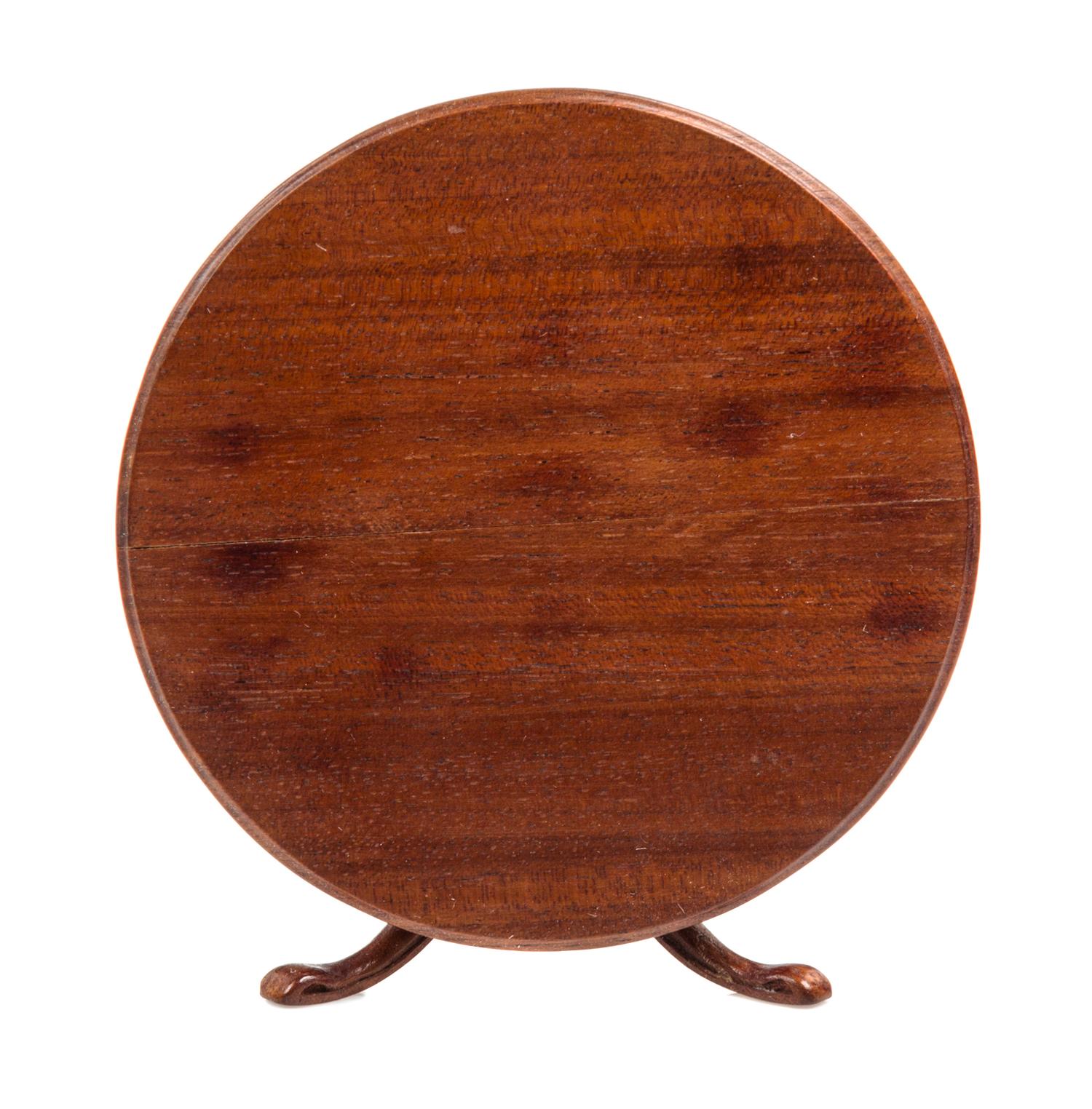 A Regency Style Mahogany Dining Table Height 2 3/8 x diameter 4 inches. — Denis E. W. Hillman, 1975