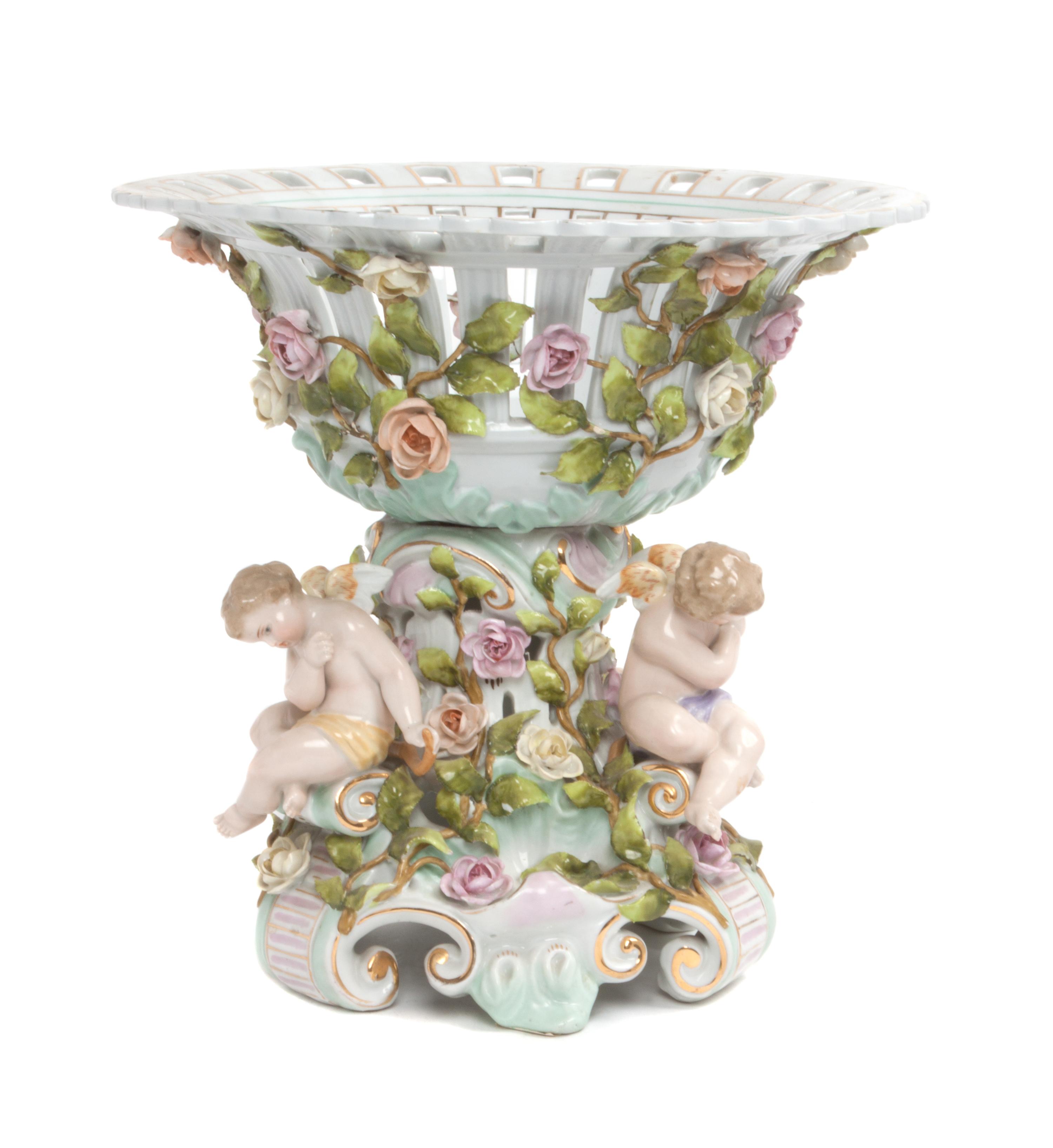 A Continental Porcelain Figural Centerpiece Height 11 1/2 inches.
