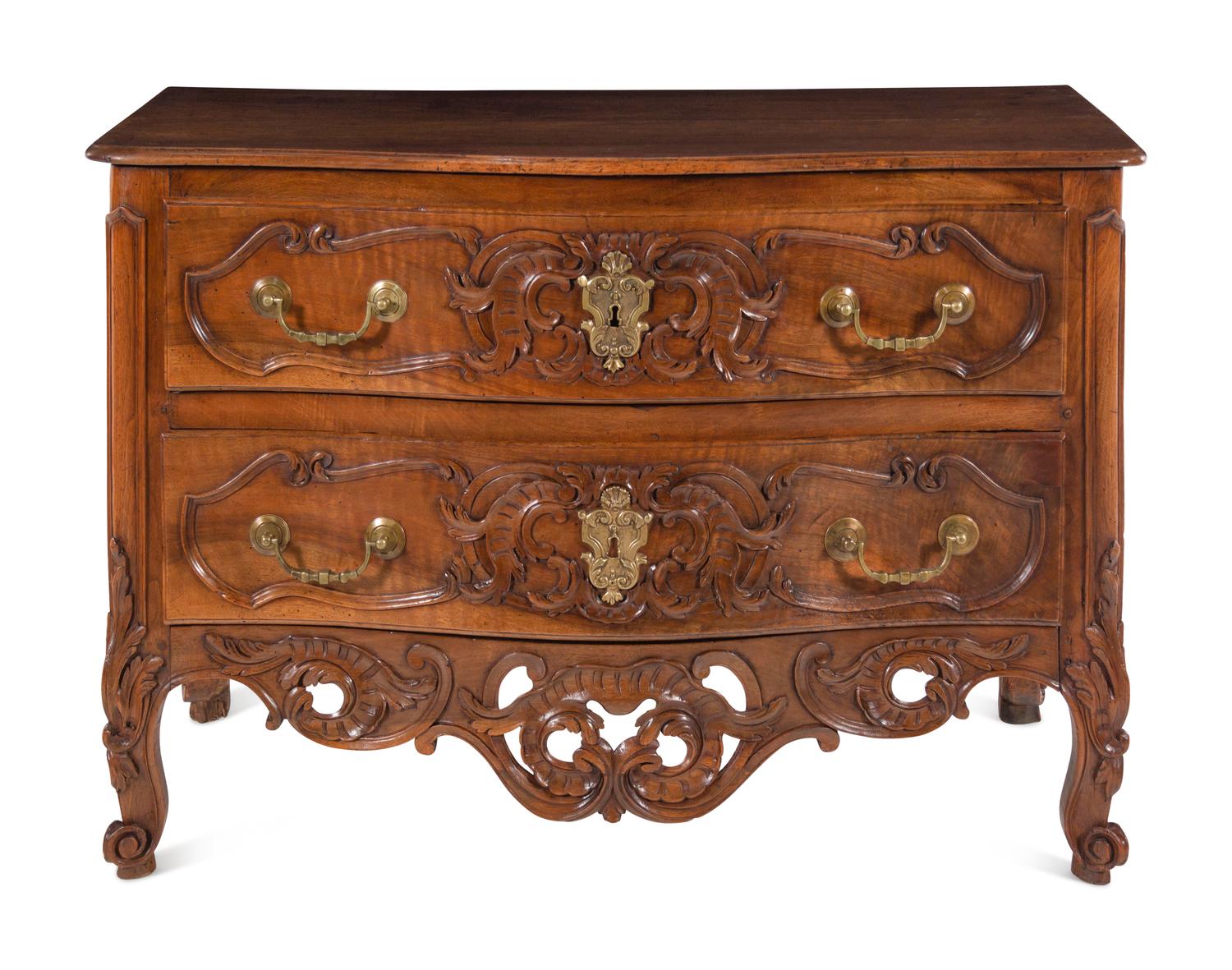 A Louis XV Provincial Carved Walnut Commode