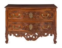 A Louis XV Provincial Carved Walnut Commode