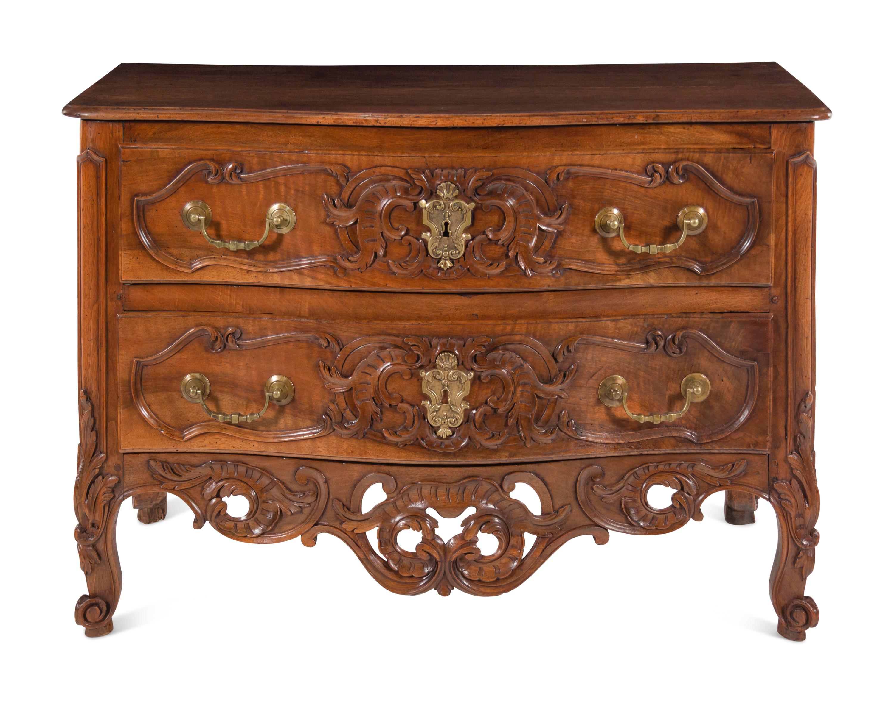 A Louis XV Provincial Carved Walnut Commode