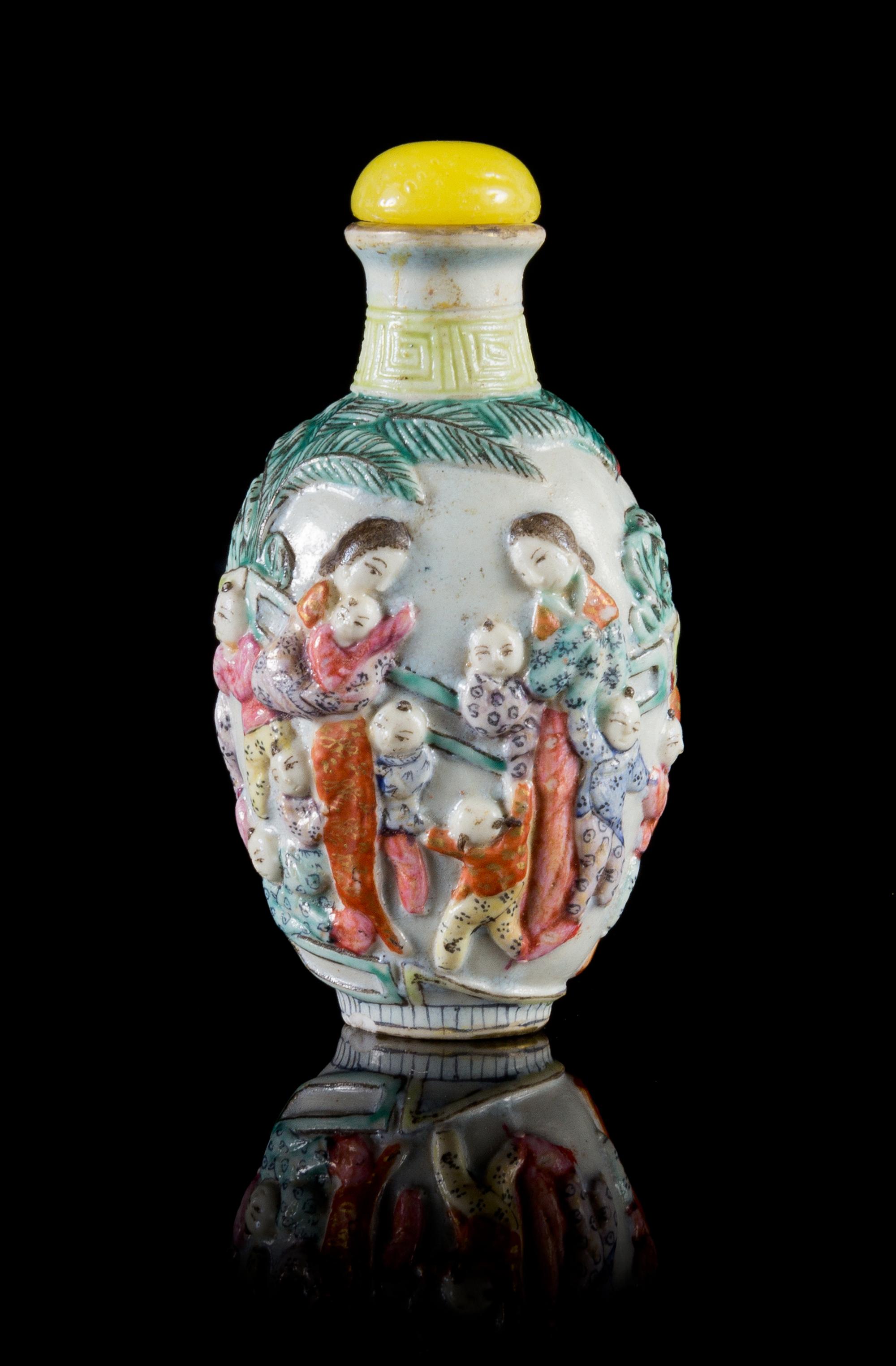A Famille Rose Porcelain Snuff Bottle Height 3 1/4 inches.