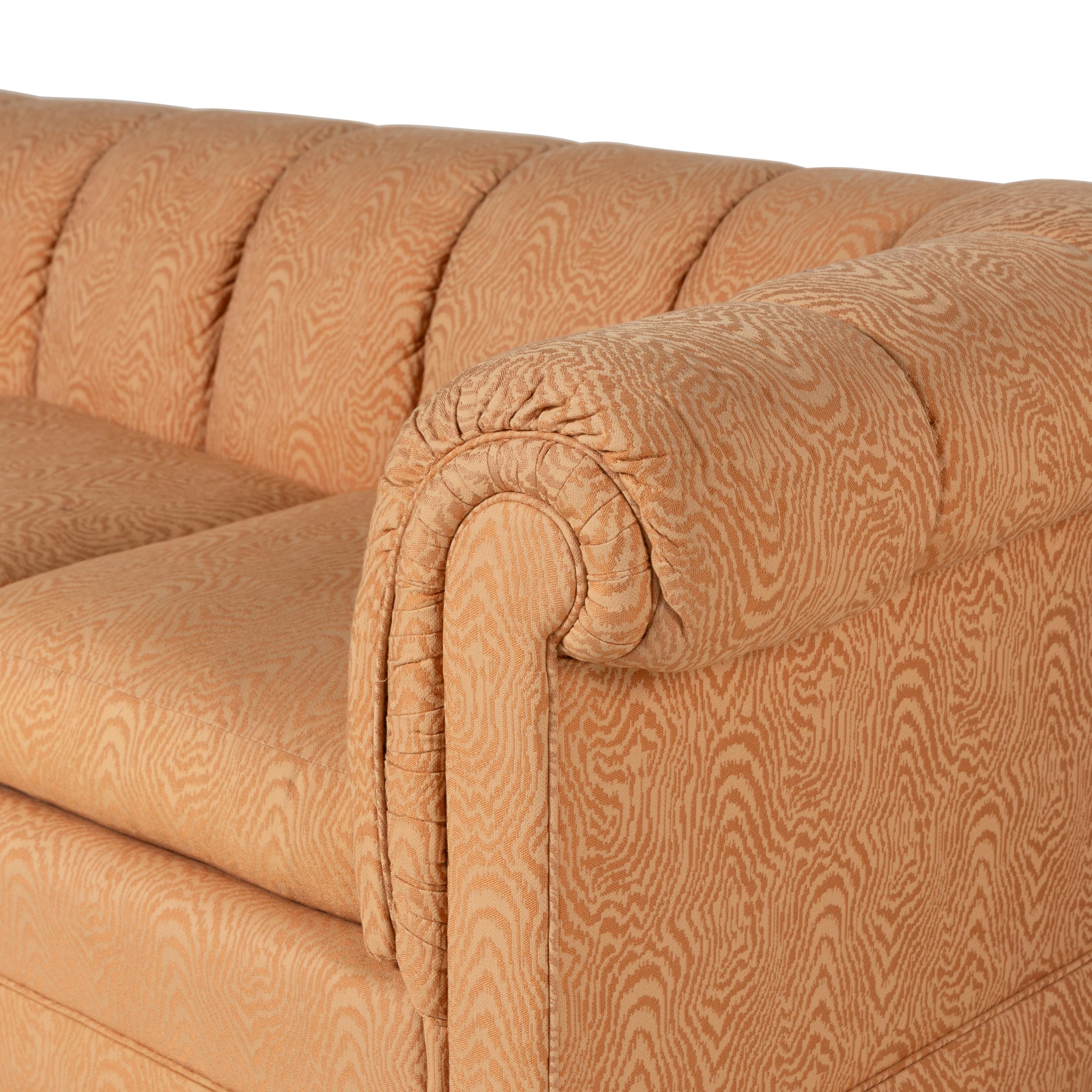 A Pair of Custom Upholstered Three-Cushion Roll-Arm Sofas