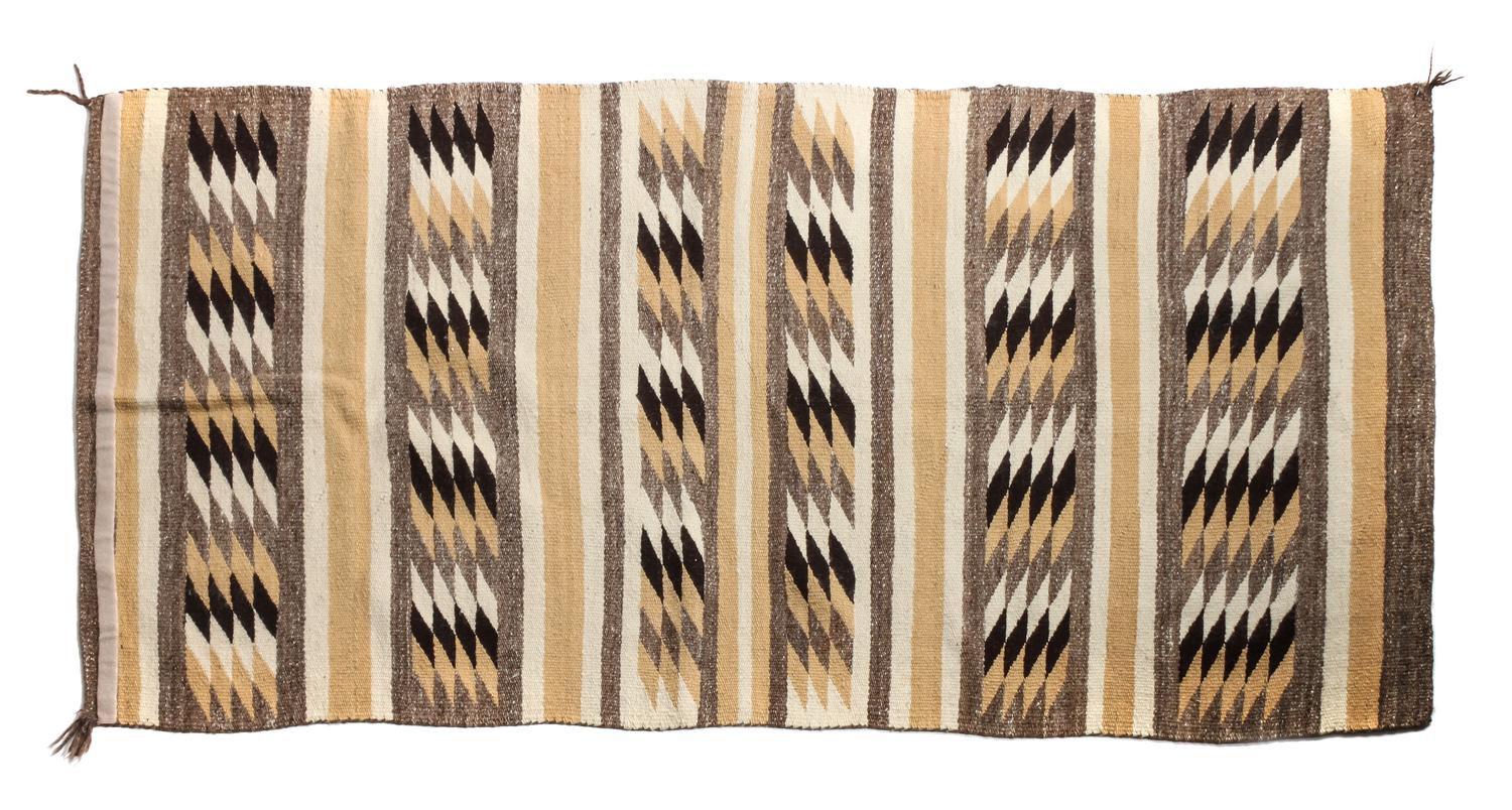 Three Navajo Rugs Largest: 69 x 34 1/2 inches