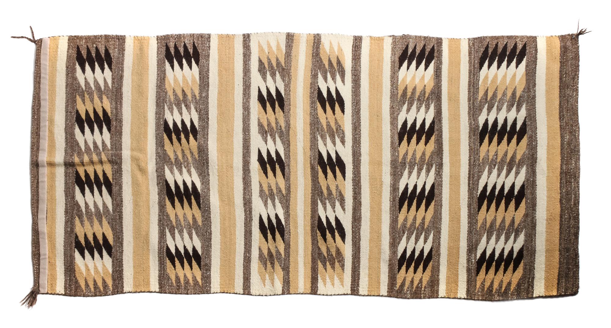 Three Navajo Rugs Largest: 69 x 34 1/2 inches
