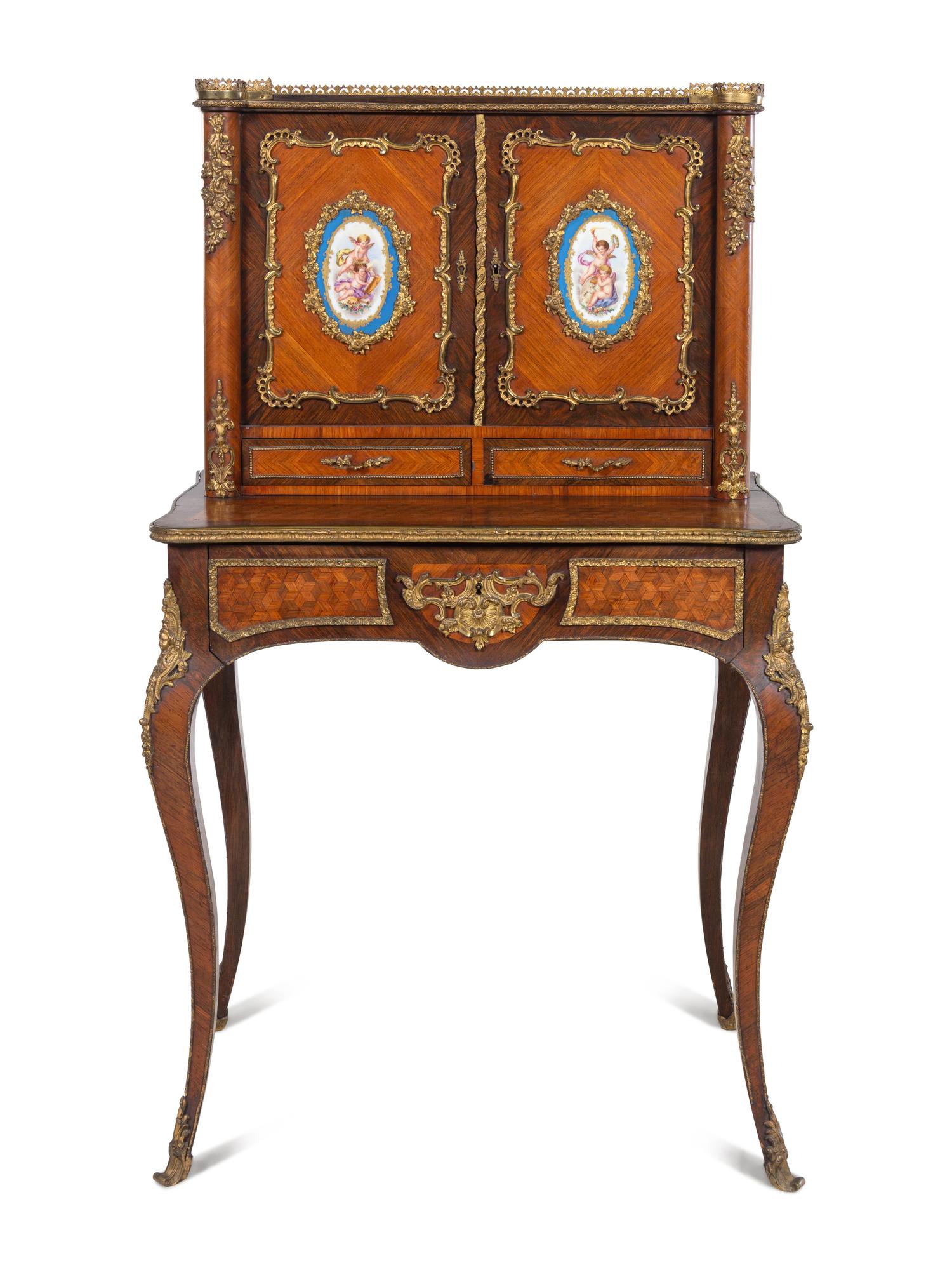A Louis XV Style Gilt Metal and Sèvres Style Porcelain Mounted Parquetry Bonheur du Jour