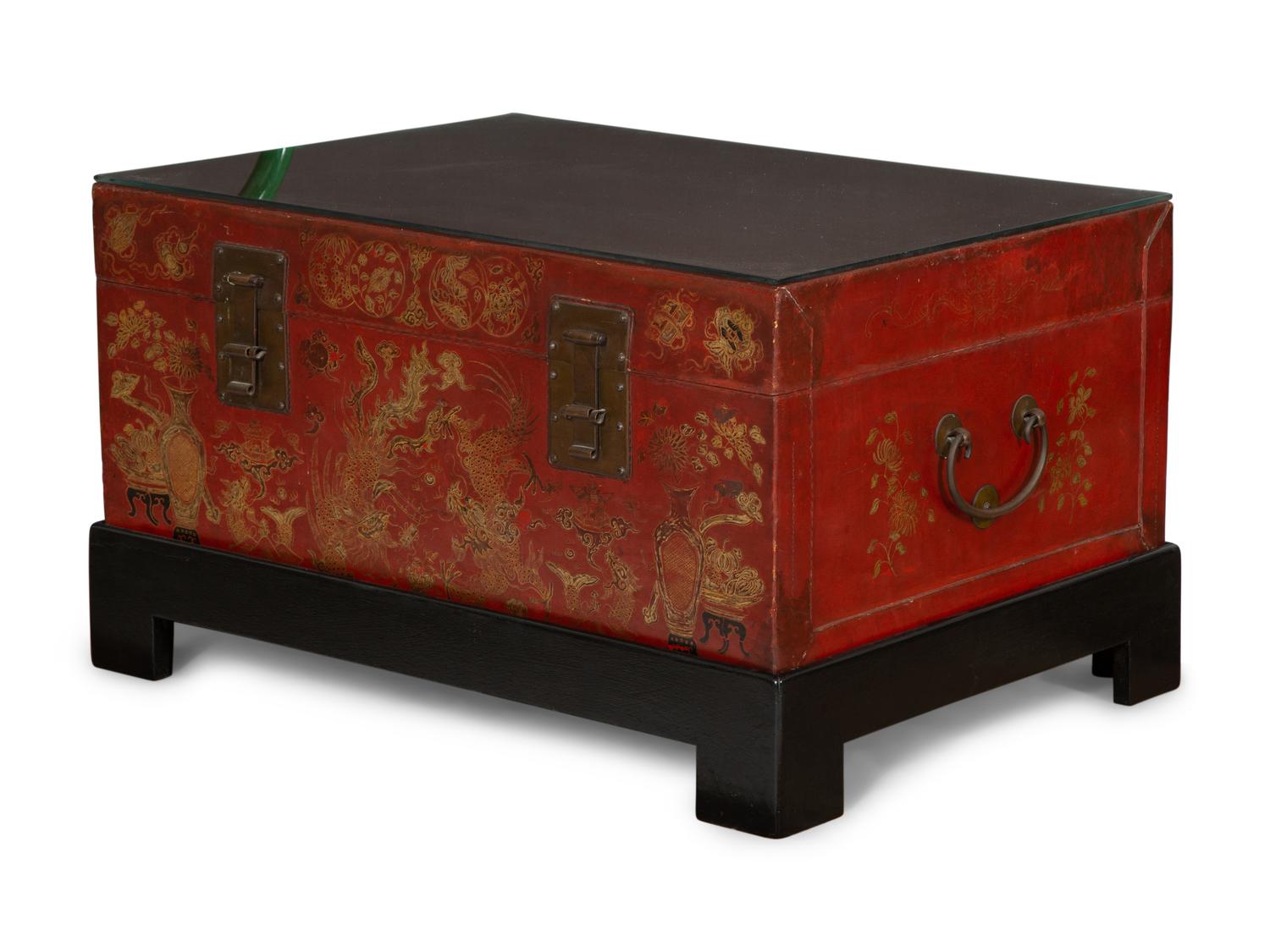 A Chinese Gilt-Decorated Red Leather Trunk on Black Lacquered Stand