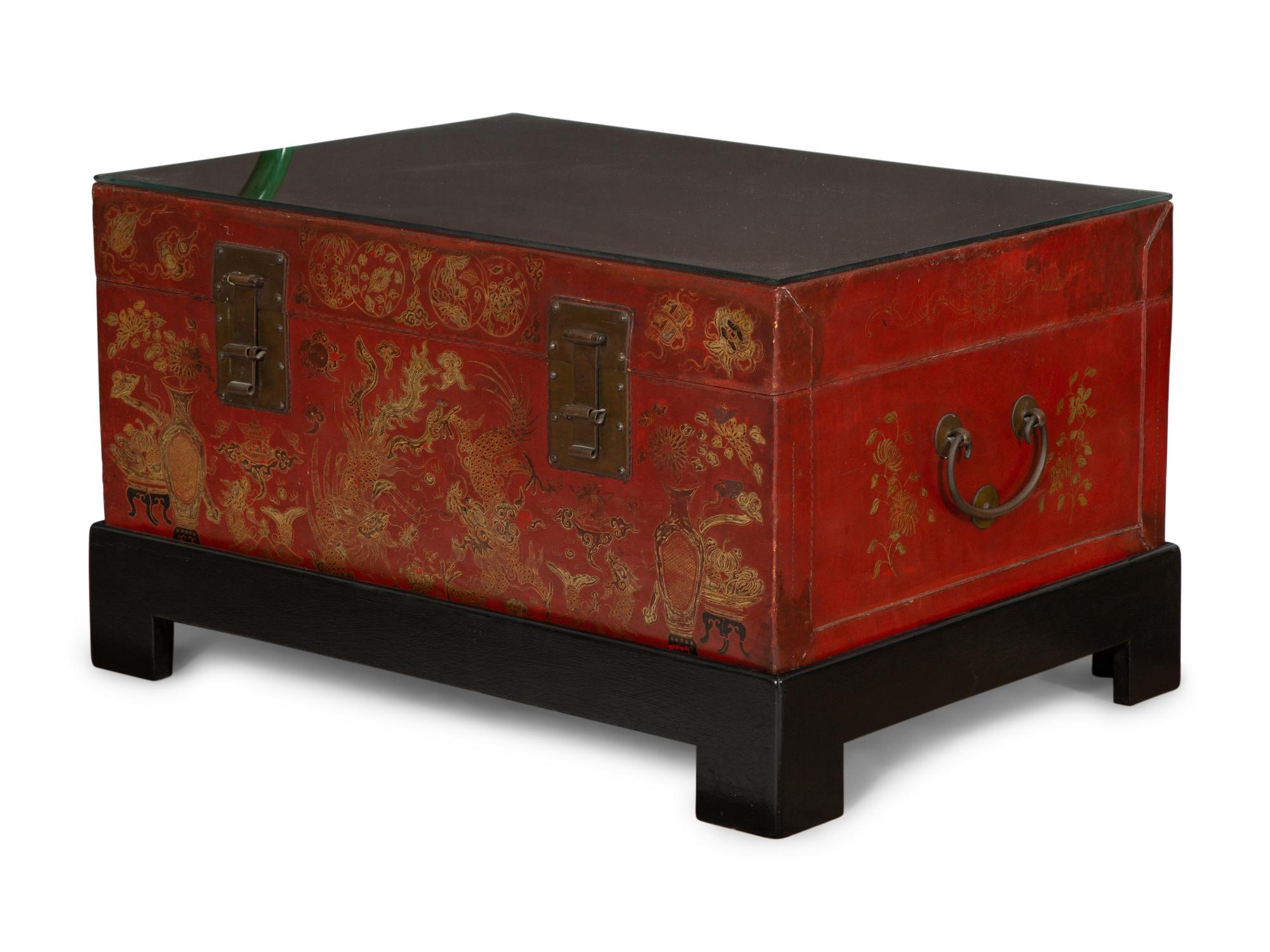 A Chinese Gilt-Decorated Red Leather Trunk on Black Lacquered Stand