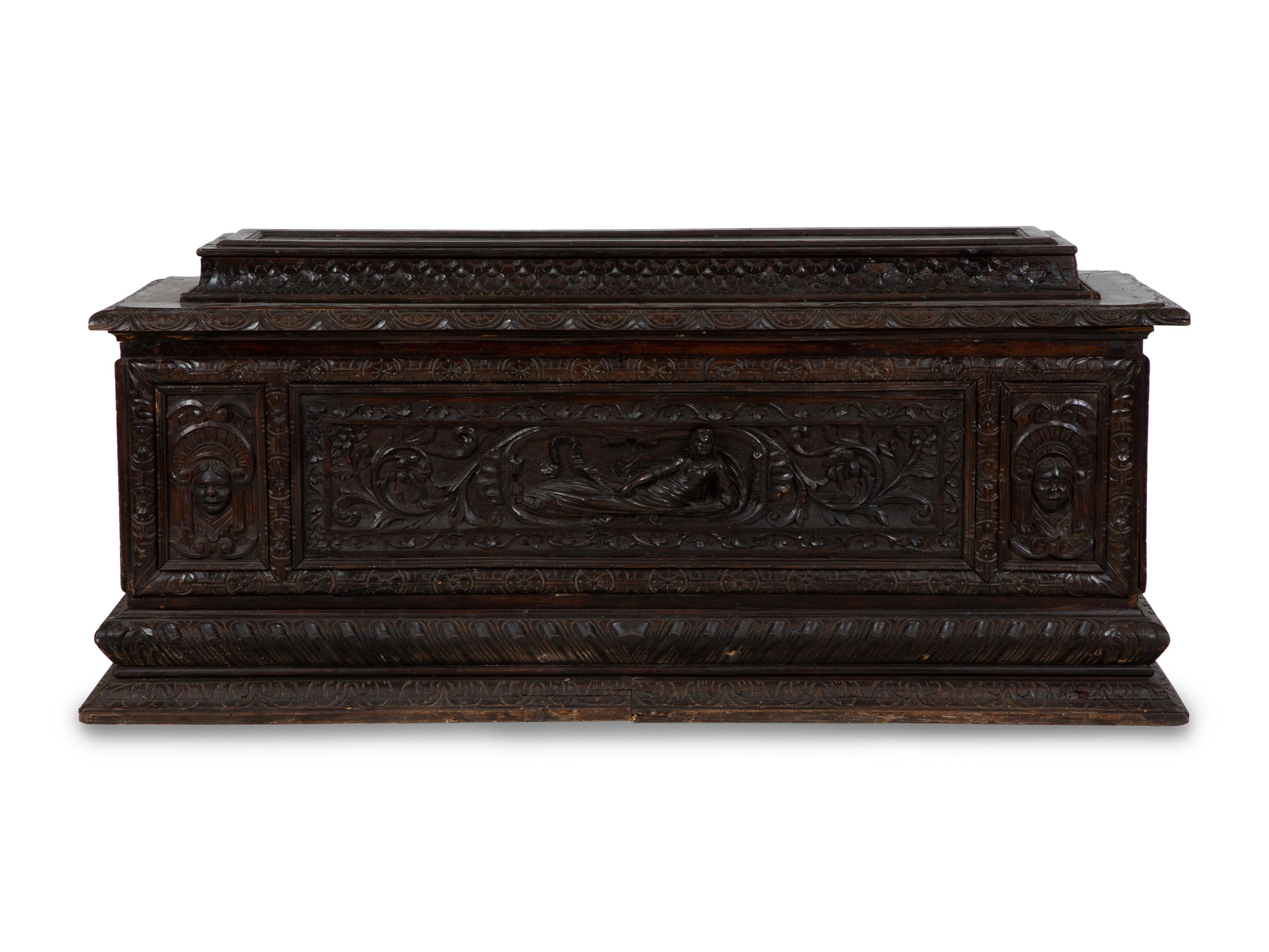 An Italian Renaissance Revival Carved Oak Cassone