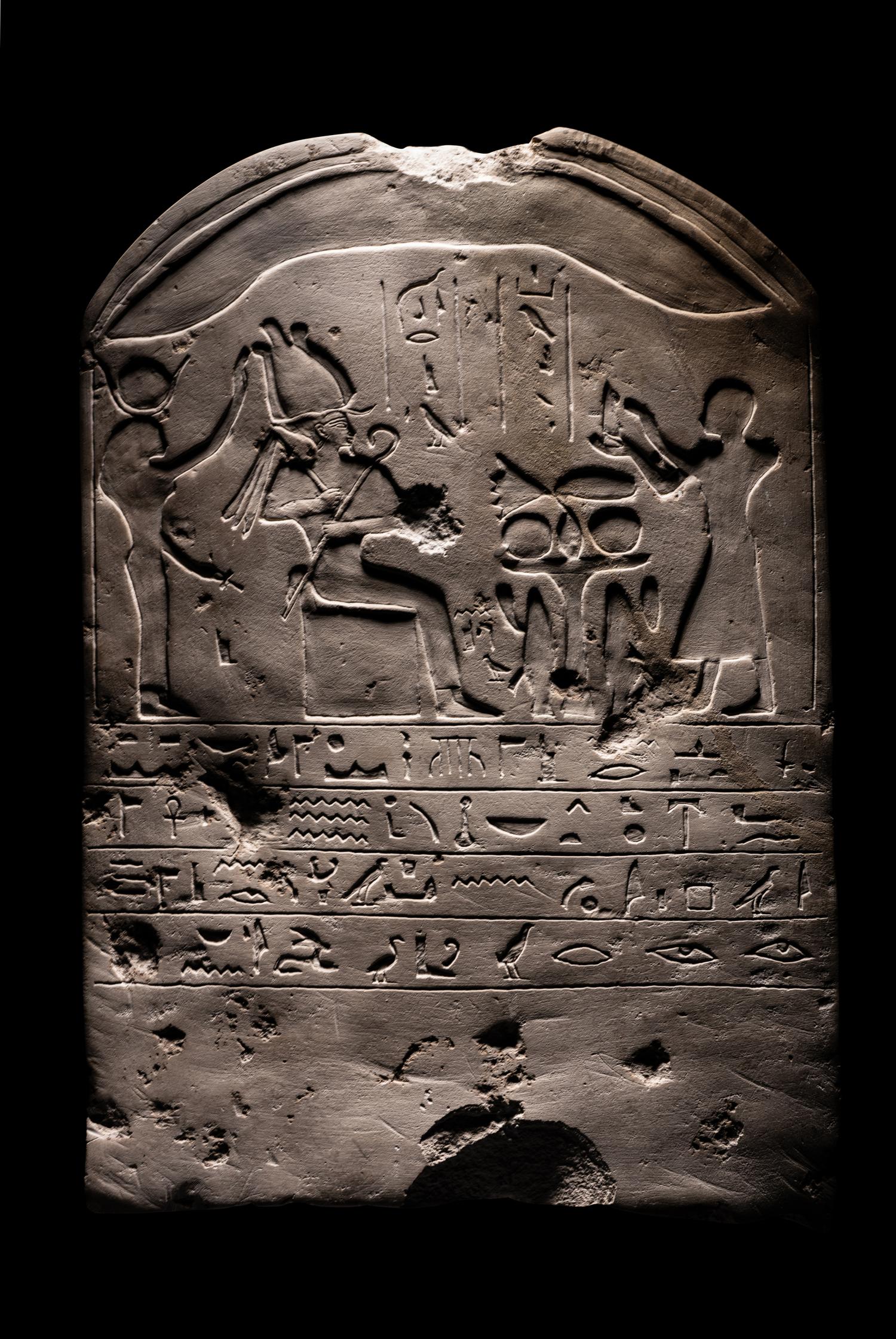 An Egyptian-Style Limestone Round-Topped Stele