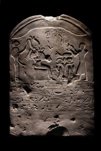 An Egyptian-Style Limestone Round-Topped Stele