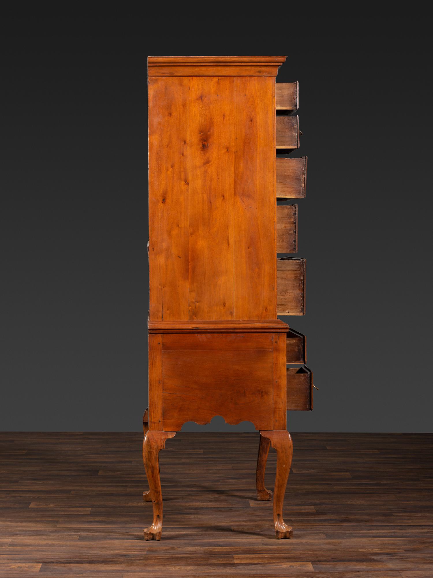 A Queen Anne Figured Walnut Flat-Top Trifid-Foot High Chest