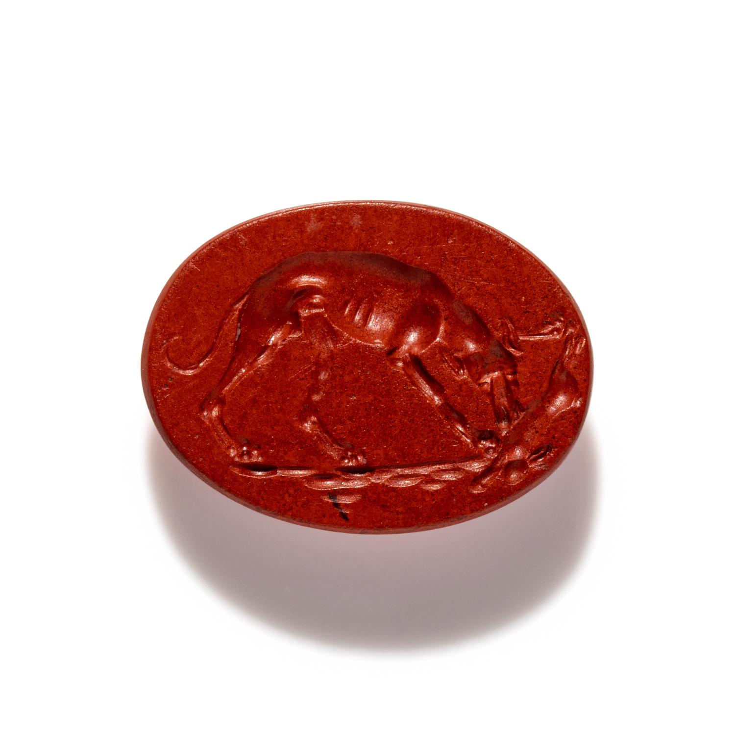 A Roman Red Jasper Ring Stone with a Coursing Hound and Hare