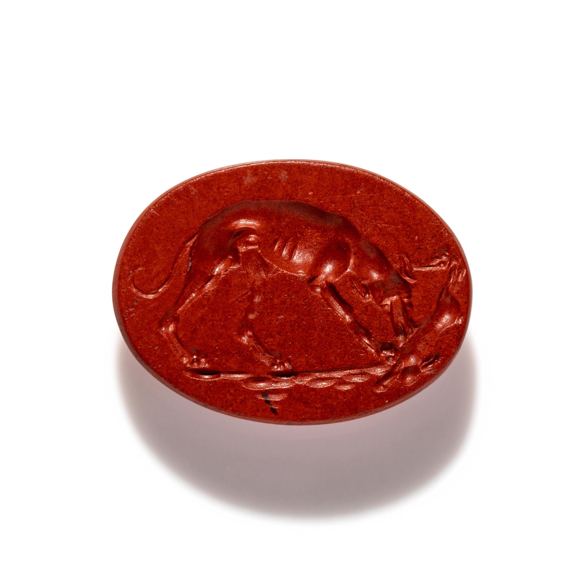 A Roman Red Jasper Ring Stone with a Coursing Hound and Hare