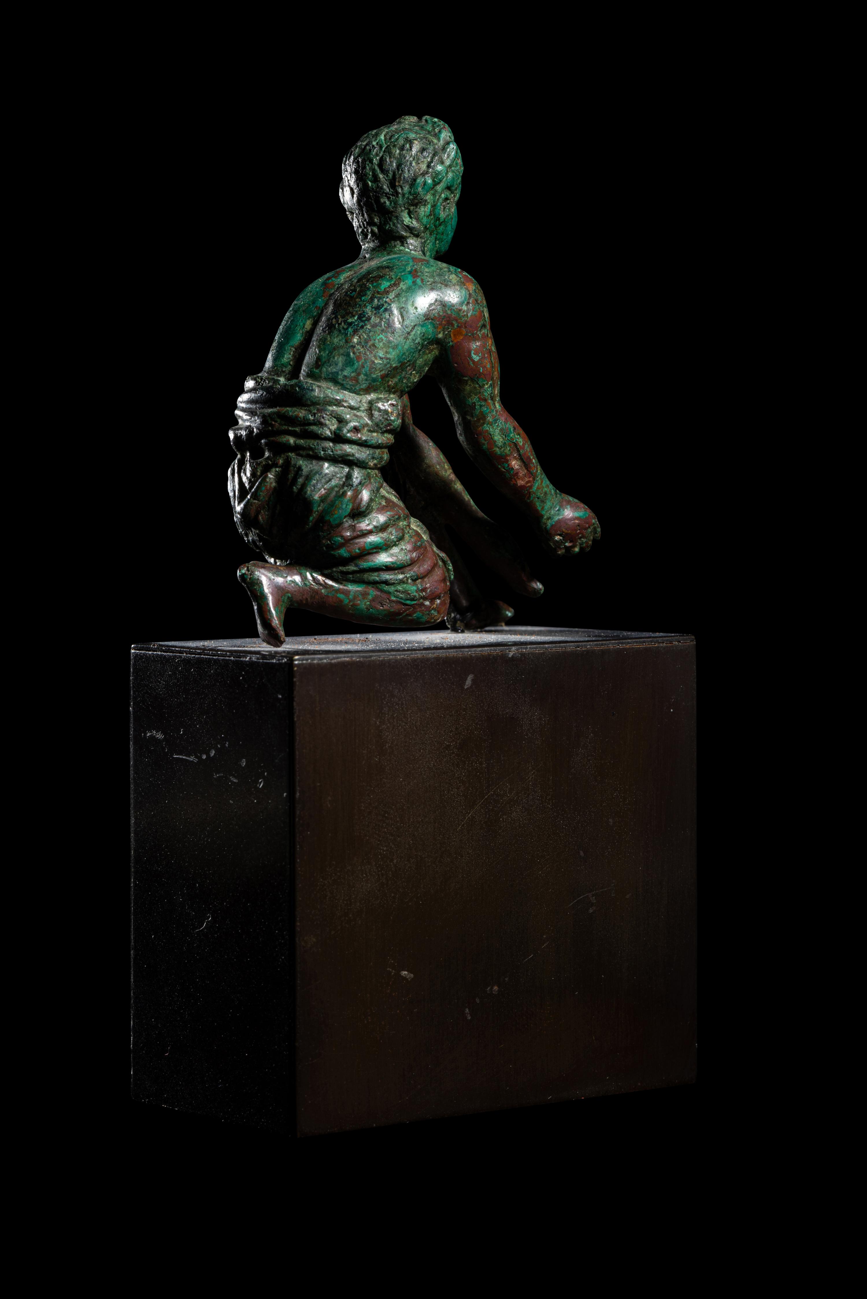 A Roman Bronze Kneeling Priest