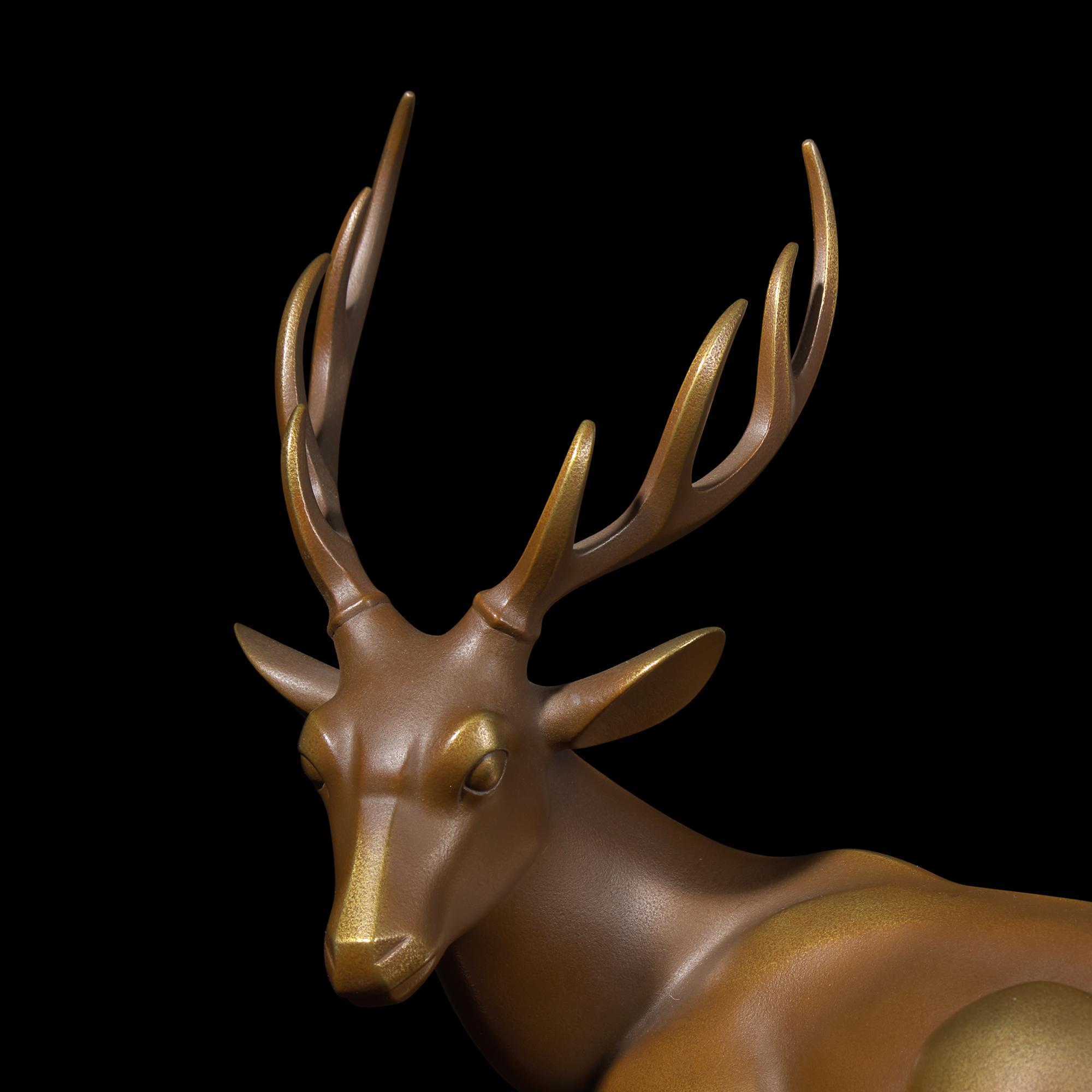 A Japanese Patinated Bronze Figure of a Recumbent Deer, Showa Period