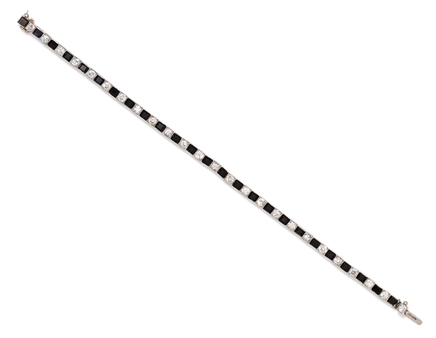 An Art Deco Platinum, Diamond and Onyx Line Bracelet, Boucheron, 8.60 dwts.