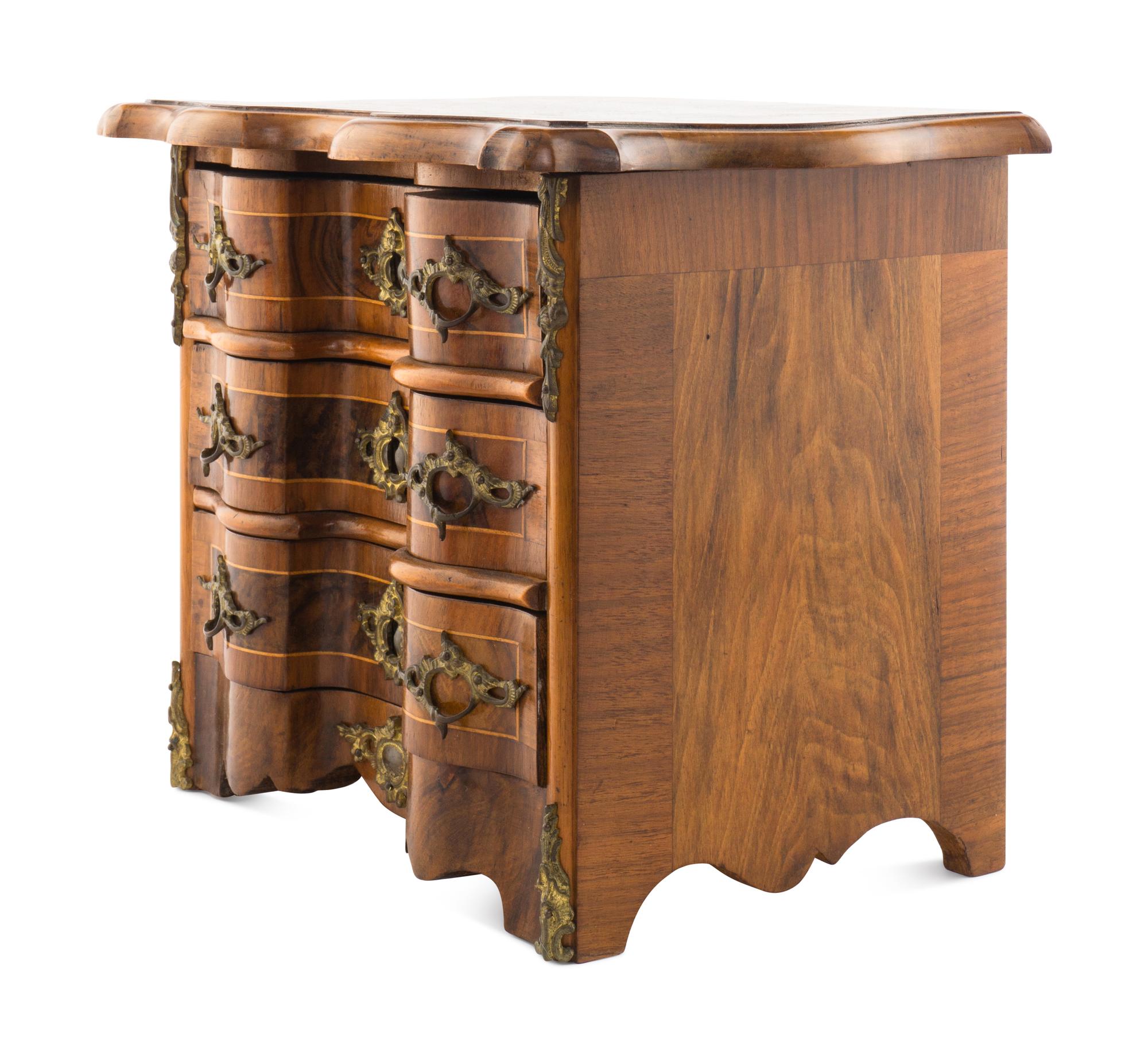 A Louis XV Style Walnut and Kingwood Diminutive Chest of Drawers