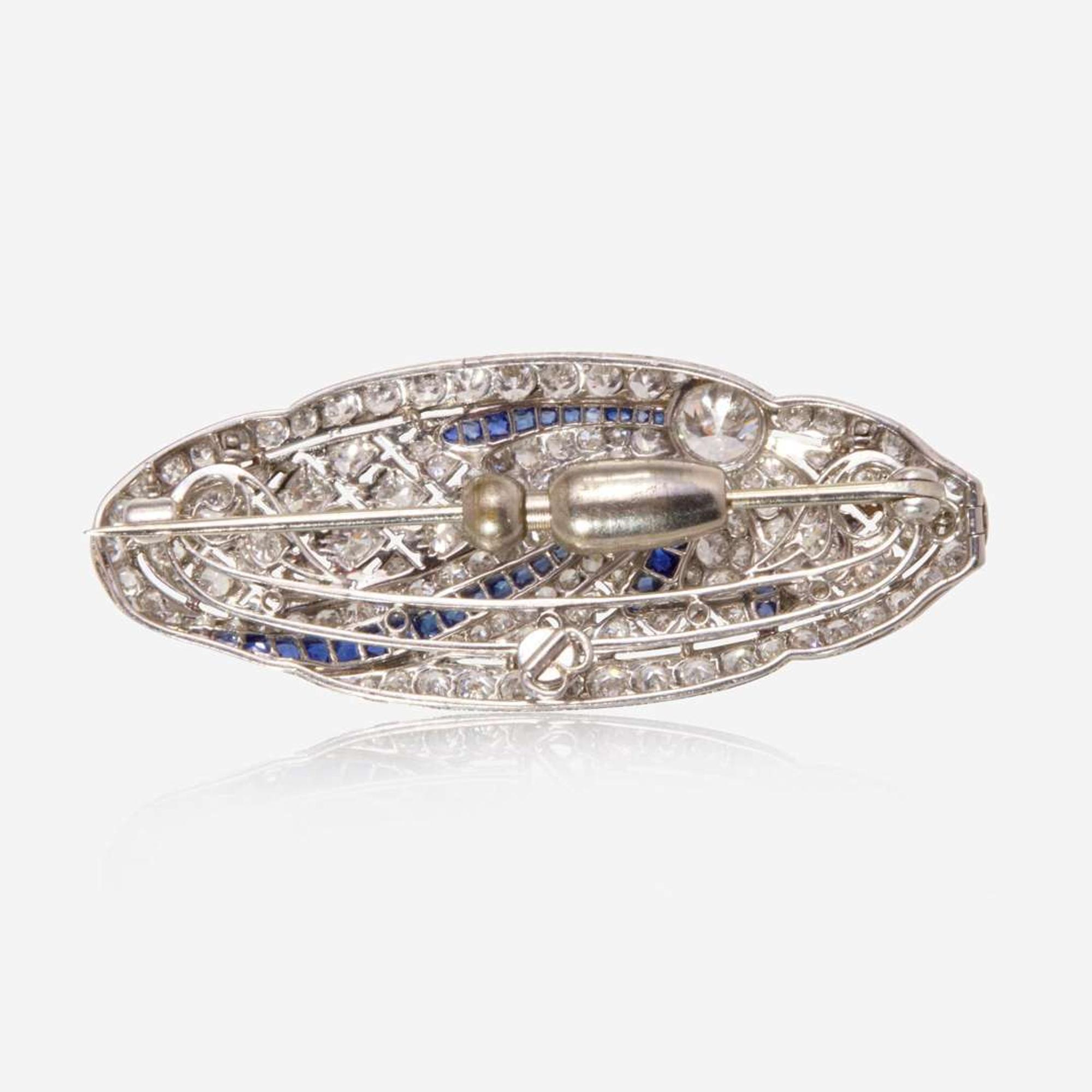 A Platinum, Diamond, and Sapphire Brooch
