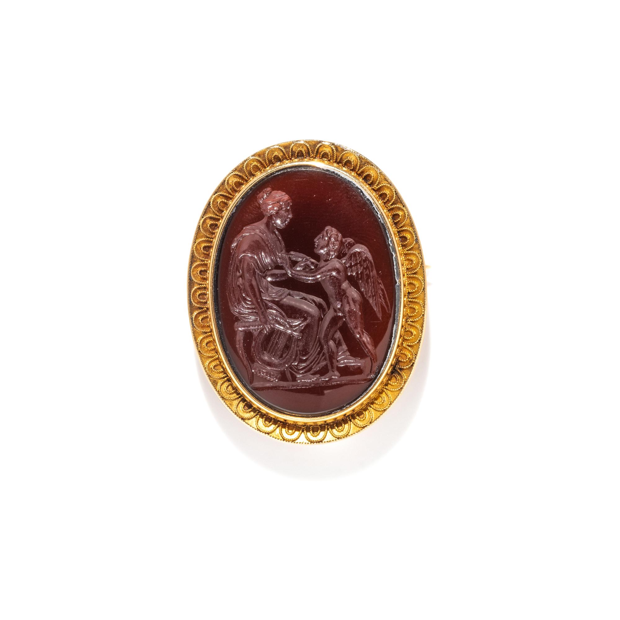 A Neoclassical Gold and Carnelian Brooch with Goddess Venus and Eros