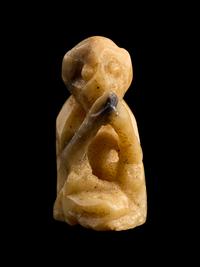 An Egyptian Carved Bone Monkey