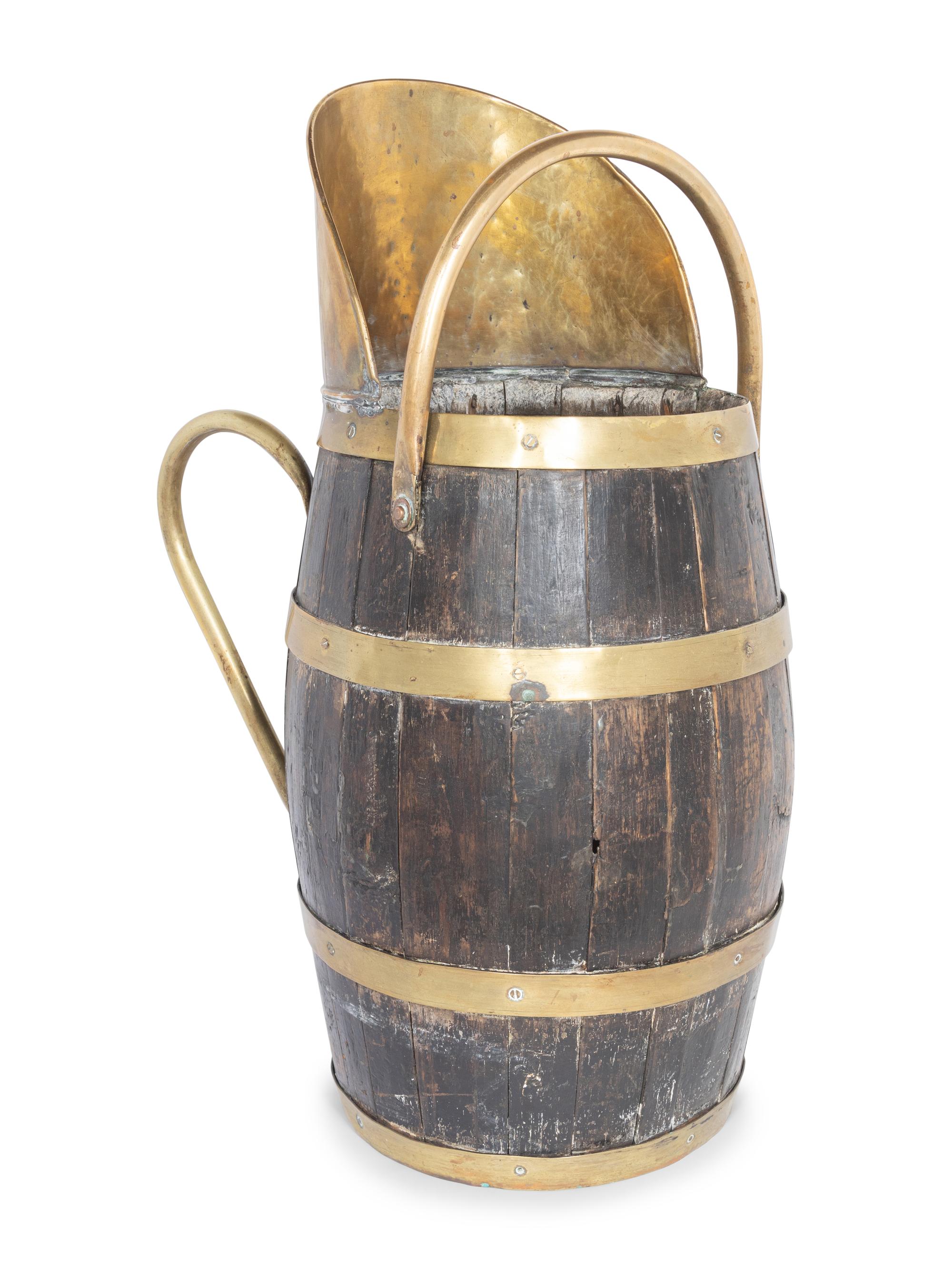 An English Brass Mounted Oak Jug