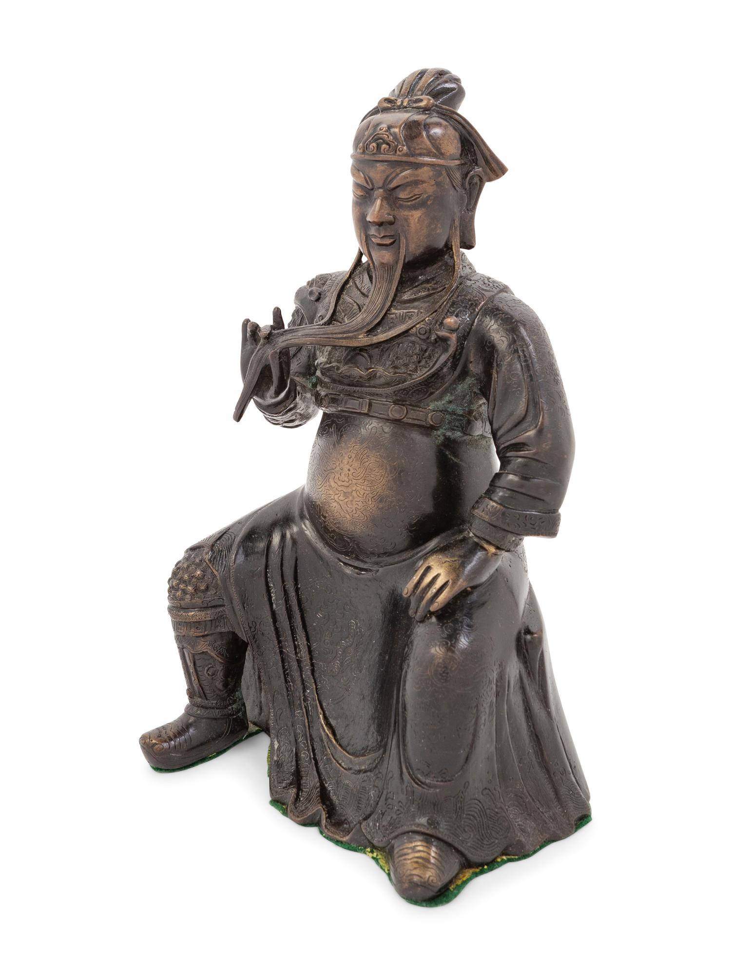 A Chinese Bronze Figure of a Seated Guardian, Guangong