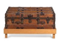A Goldsmith & Son Never Break Trunk Raised on a Later Stand as a Table