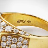 An 18K Yellow Gold, Diamond, and Emerald Ring
