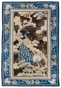A Chinese Wool Rug 6 feet 9 inches x 4 feet 1 inch. — FIRST HALF, 20TH CENTURY