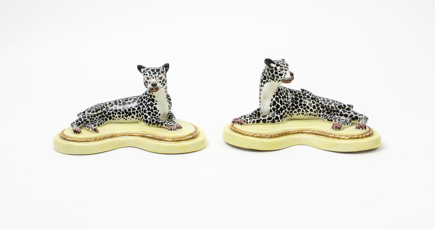 A Pair of Porcelain Models of Recumbent Cheetahs Width 7 3/4 inches. — 20TH CENTURY